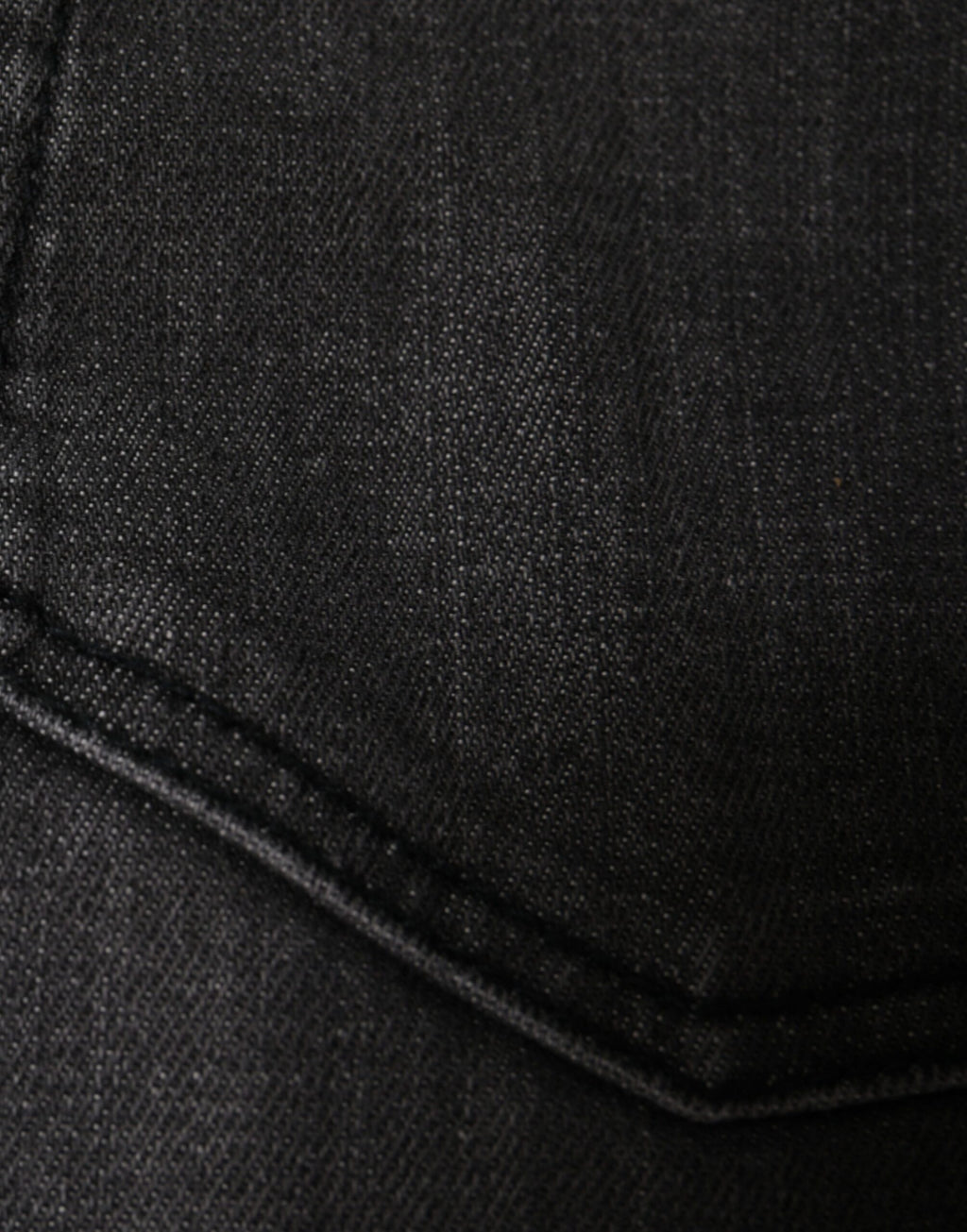 Jeans slim en denim noir tissé déchiré de Dolce & Gabbana pour homme, coupe ajustée et détails usés visibles.