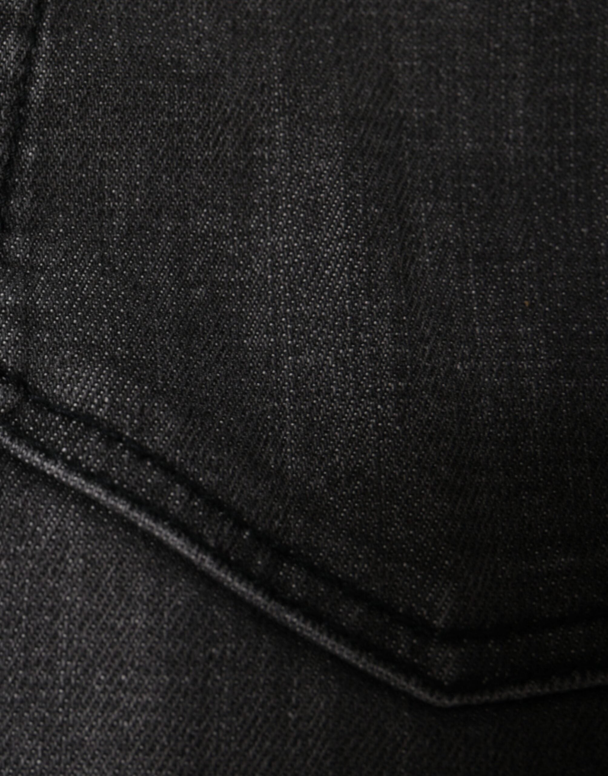 Jeans slim en denim noir tissé déchiré de Dolce & Gabbana pour homme, coupe ajustée et détails usés visibles.