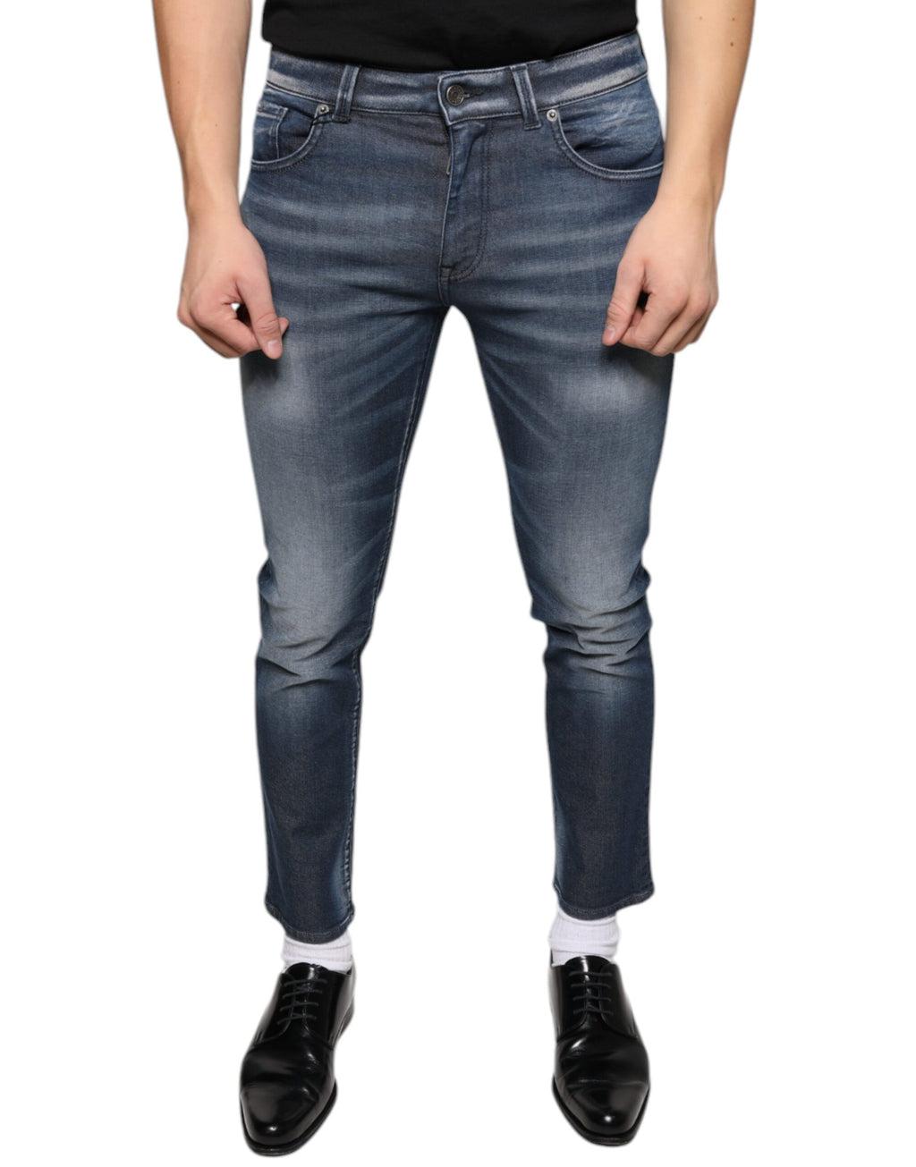 Jeans skinny en denim en coton lavé bleu foncé de Dolce & Gabbana, ajustés et modernes, visibles en gros plan.