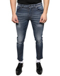 Jeans skinny en denim en coton lavé bleu foncé de Dolce & Gabbana, ajustés et modernes, visibles en gros plan.