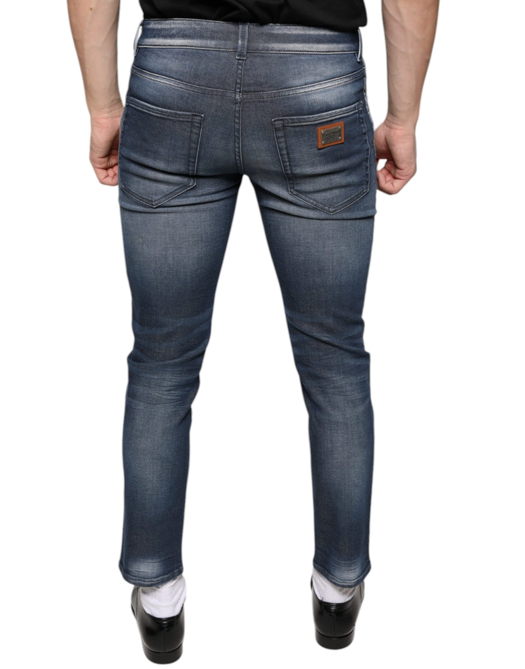 Jeans skinny en denim coton lavé bleu foncé de Dolce & Gabbana, pantalon ajusté avec finition usée.