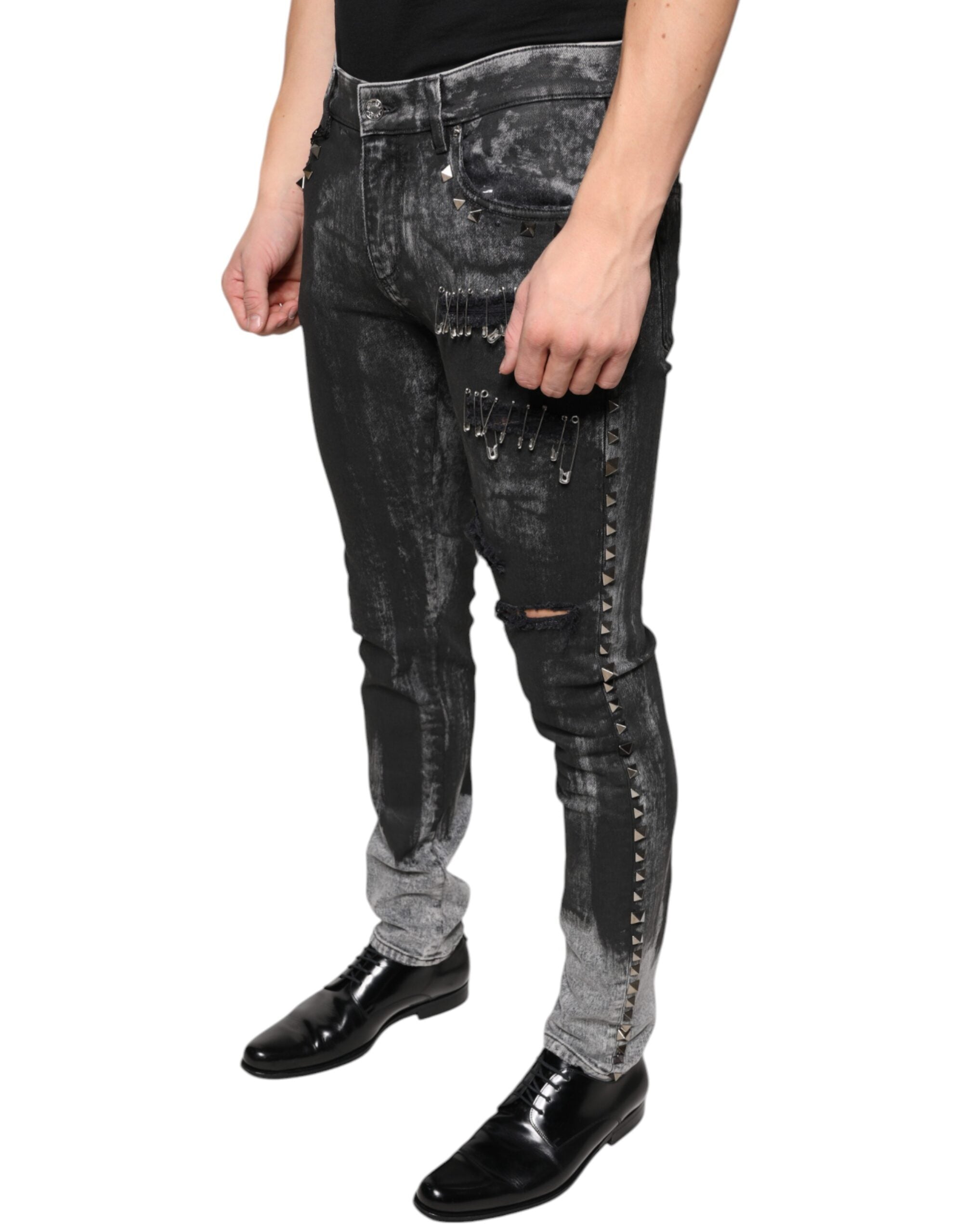 Jeans skinny en denim noir Dolce & Gabbana avec embellissements en coton, affichant un style élégant et tendance.