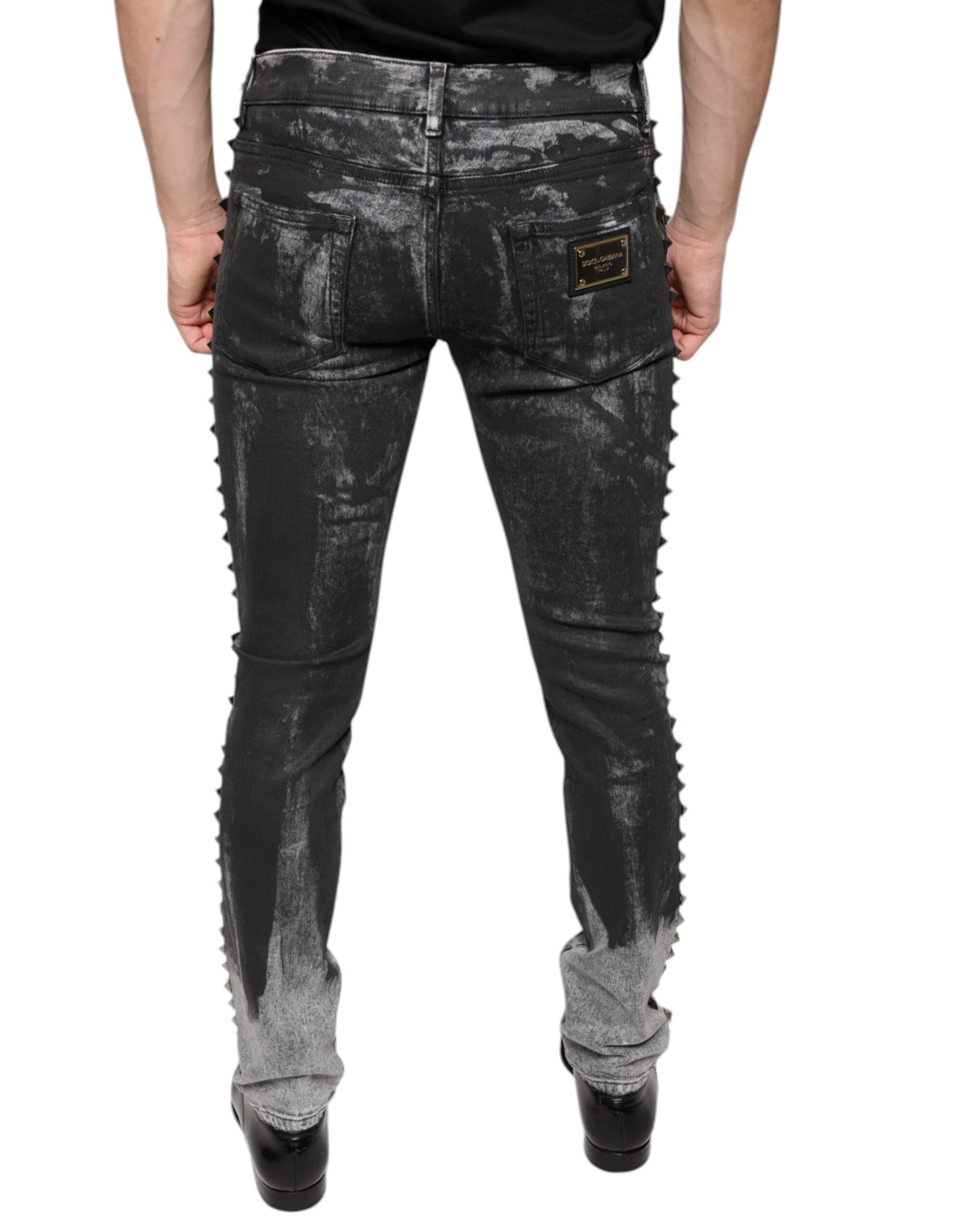 Jeans skinny en denim coton noir Dolce & Gabbana avec embellissements, visibles détails de broderie et finition élégante.