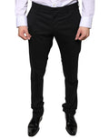 Pantalon formel en laine noire de Dolce & Gabbana, coupe skinny, élégant et sophistiqué, idéal pour occasions formelles.