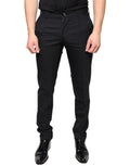 Pantalons habillés en laine noire Dolce & Gabbana pour homme, coupe skinny, élégants et modernes.