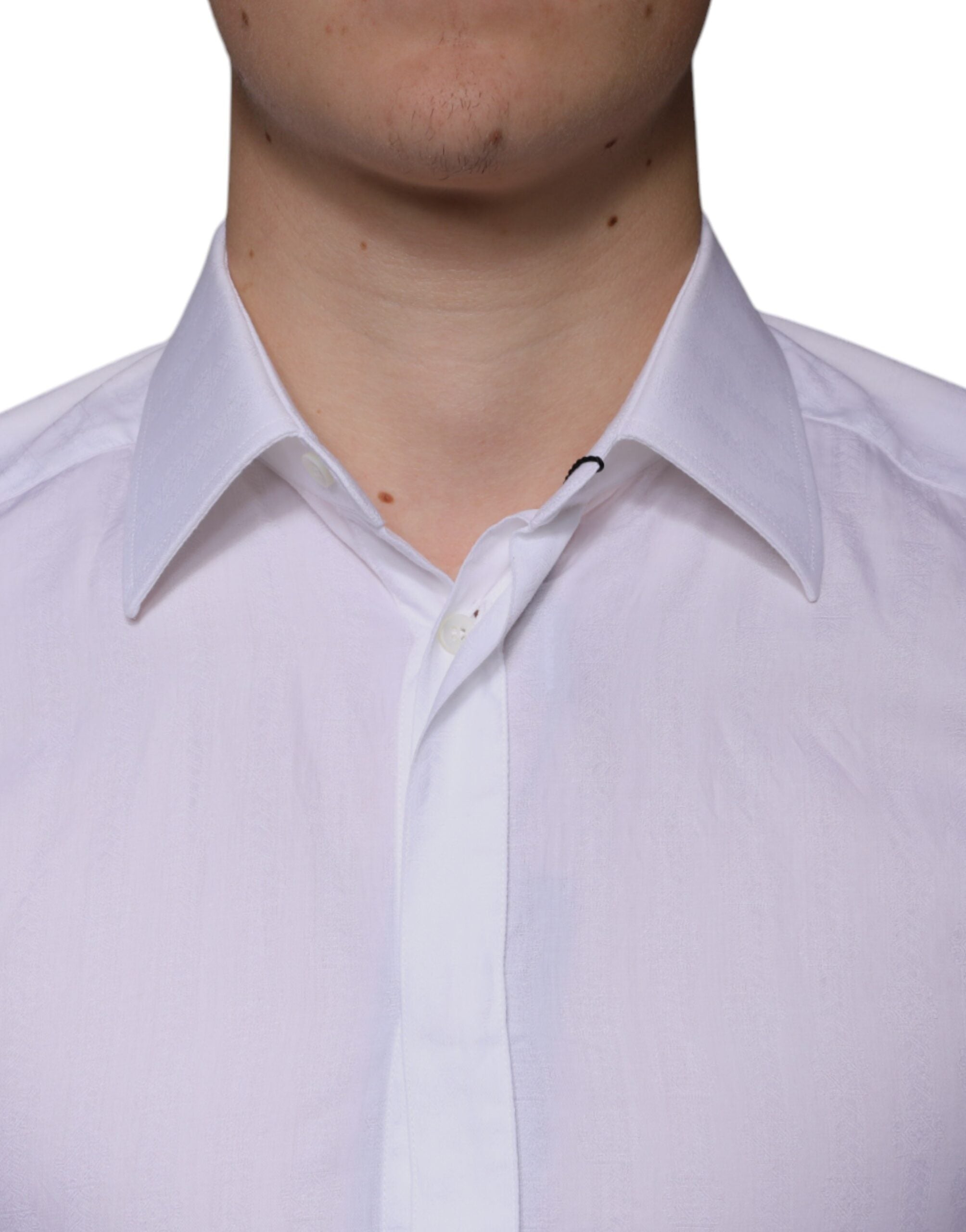 Chemise formelle blanche en coton pour homme Dolce & Gabbana, style élégant avec boutons dorés et col classique.