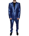 Costume formel trois pièces Dolce & Gabbana avec rayures bleues métalliques, veste, pantalon et gilet élégants.