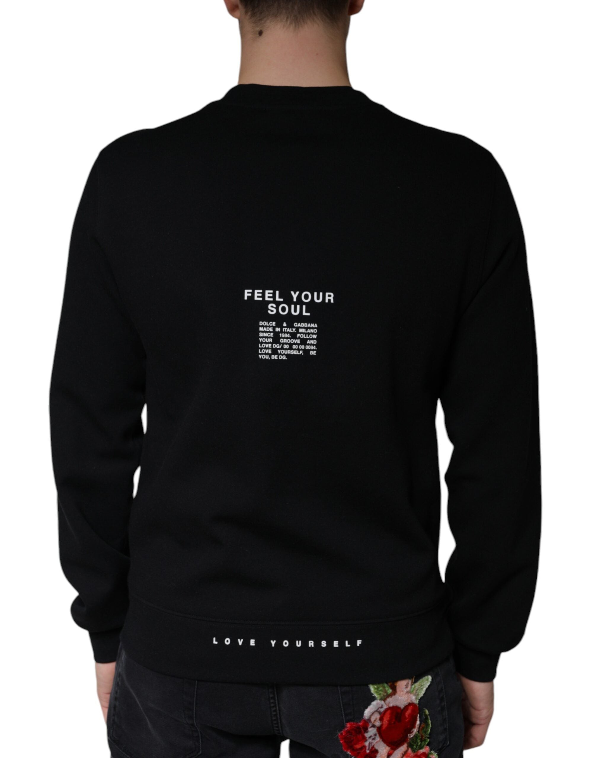 Sweat-shirt noir Dolce & Gabbana avec logo imprimé, col rond, en coton, porté de face.