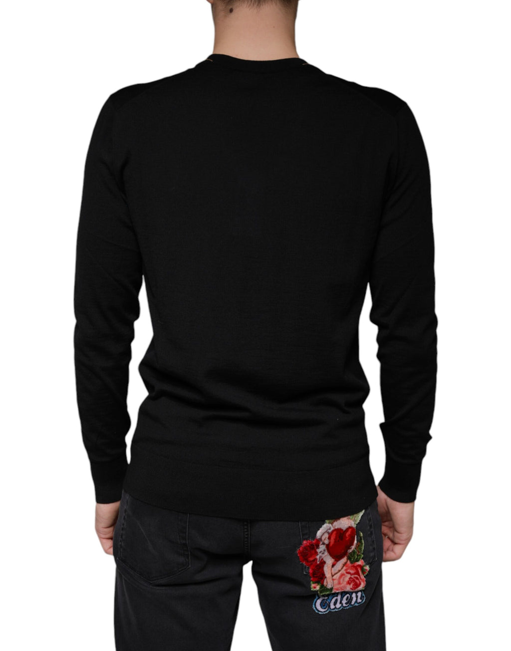 Pull en cachemire noir Dolce & Gabbana à col en V avec embellissements visibles, style élégant et sophistiqué.