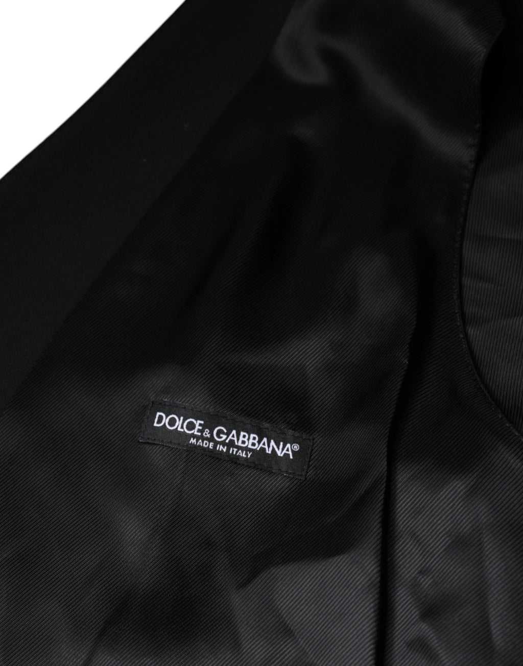 Gilet homme Dolce & Gabbana en laine noire pour tenue formelle, ajusté et élégant, avec col et fermeture à boutons.