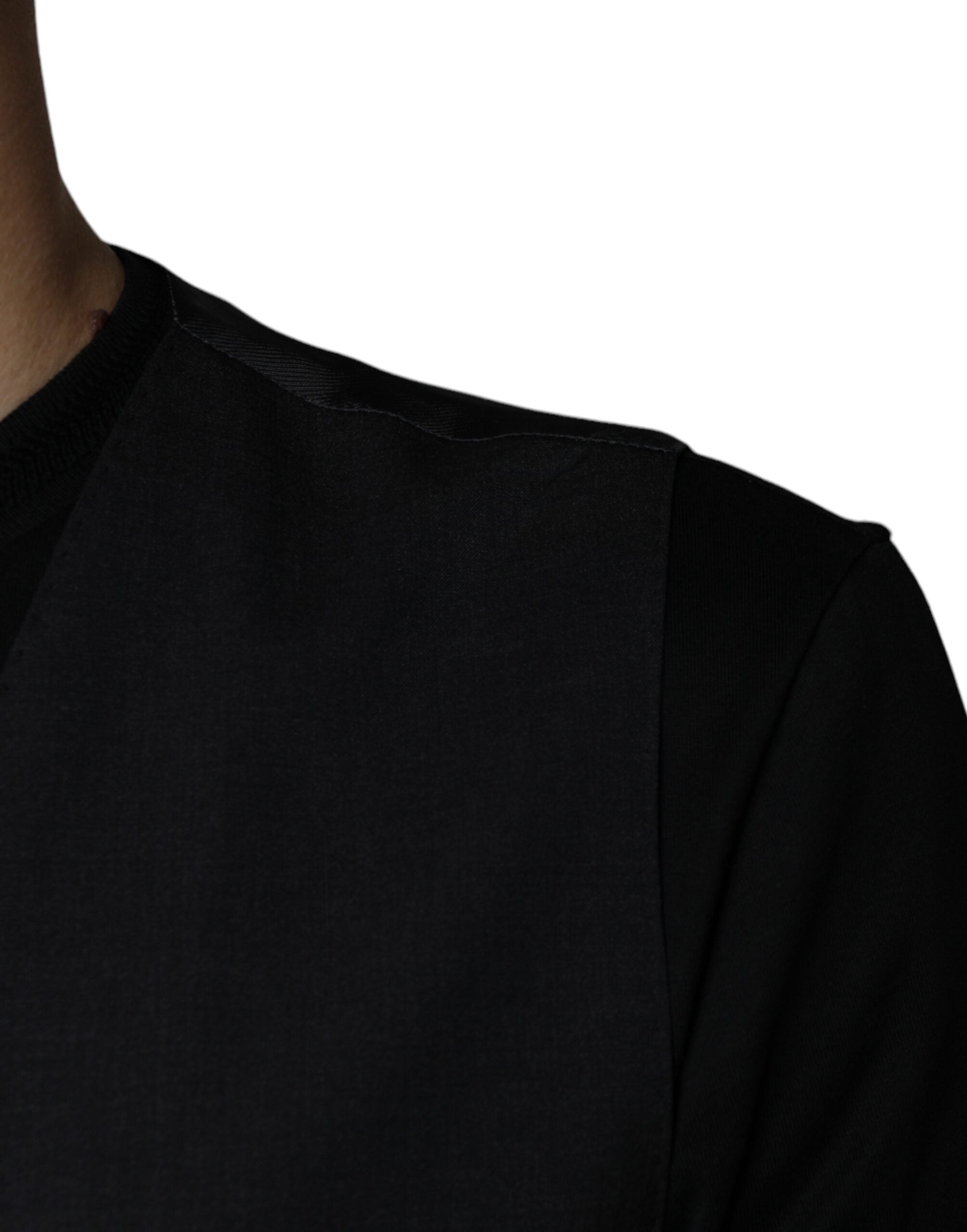 Robe-ventre en laine noire Dolce & Gabbana, veste formelle ajustée avec col en V et détails élégants.