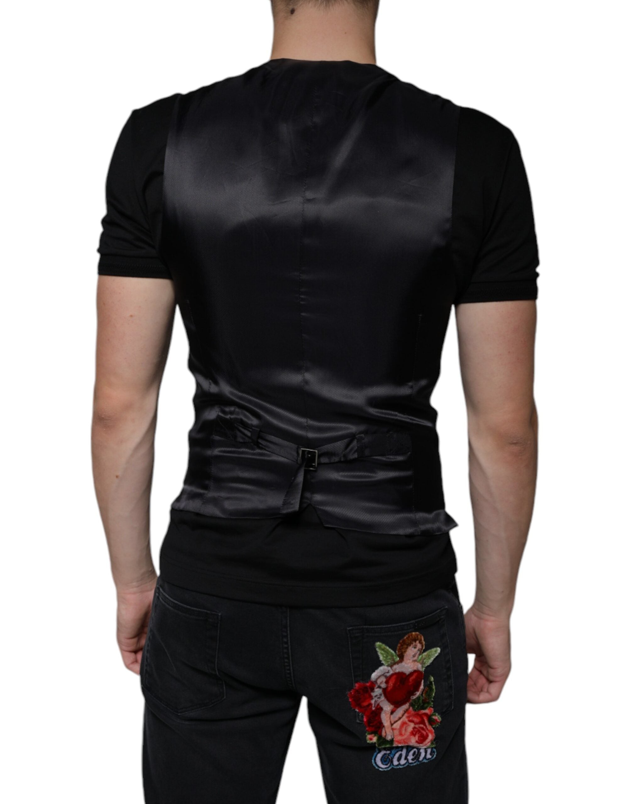 Robe sans manches en cuir noir de Dolce & Gabbana, veste formelle élégante pour femmes, détails sophistiqués.