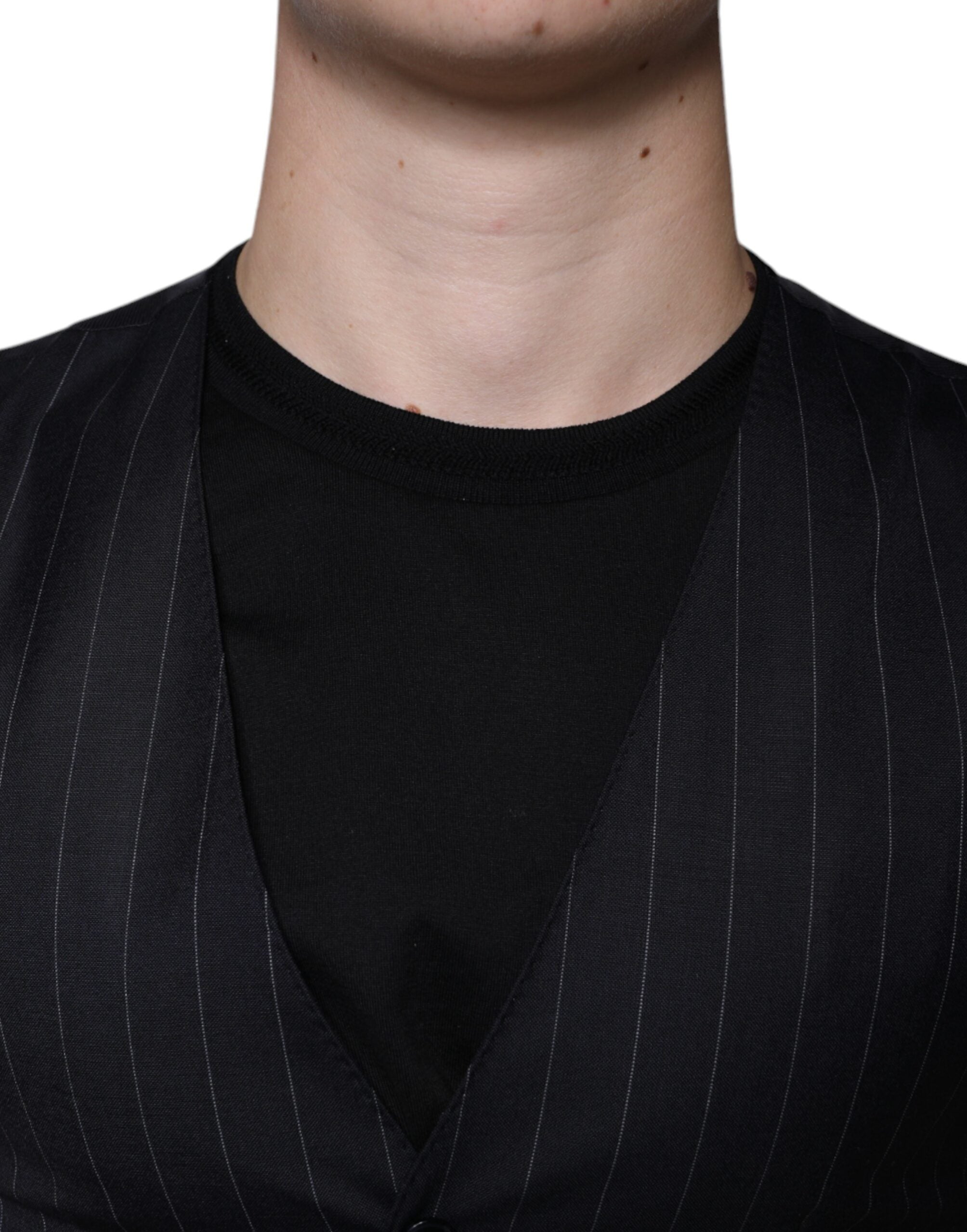 Robe sans manches en cuir noir Dolce & Gabbana, veste formelle élégante avec ceinture à la taille.