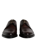 Chaussures derby en cuir marron Dolce & Gabbana pour homme, lacets, style formel et élégant.