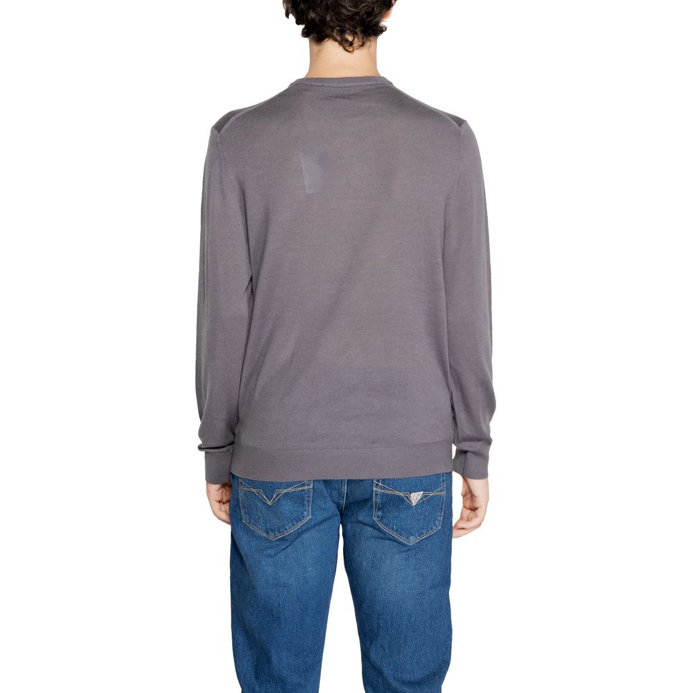 Sweatshirt gris en laine Armani Exchange, coupe décontractée, col rond, manches longues, idéal pour un style confortable et chic.