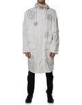 Veste parka blanche à capuche Dolce & Gabbana en polyester, trench coat décontracté avec ceinture et détails modernes.