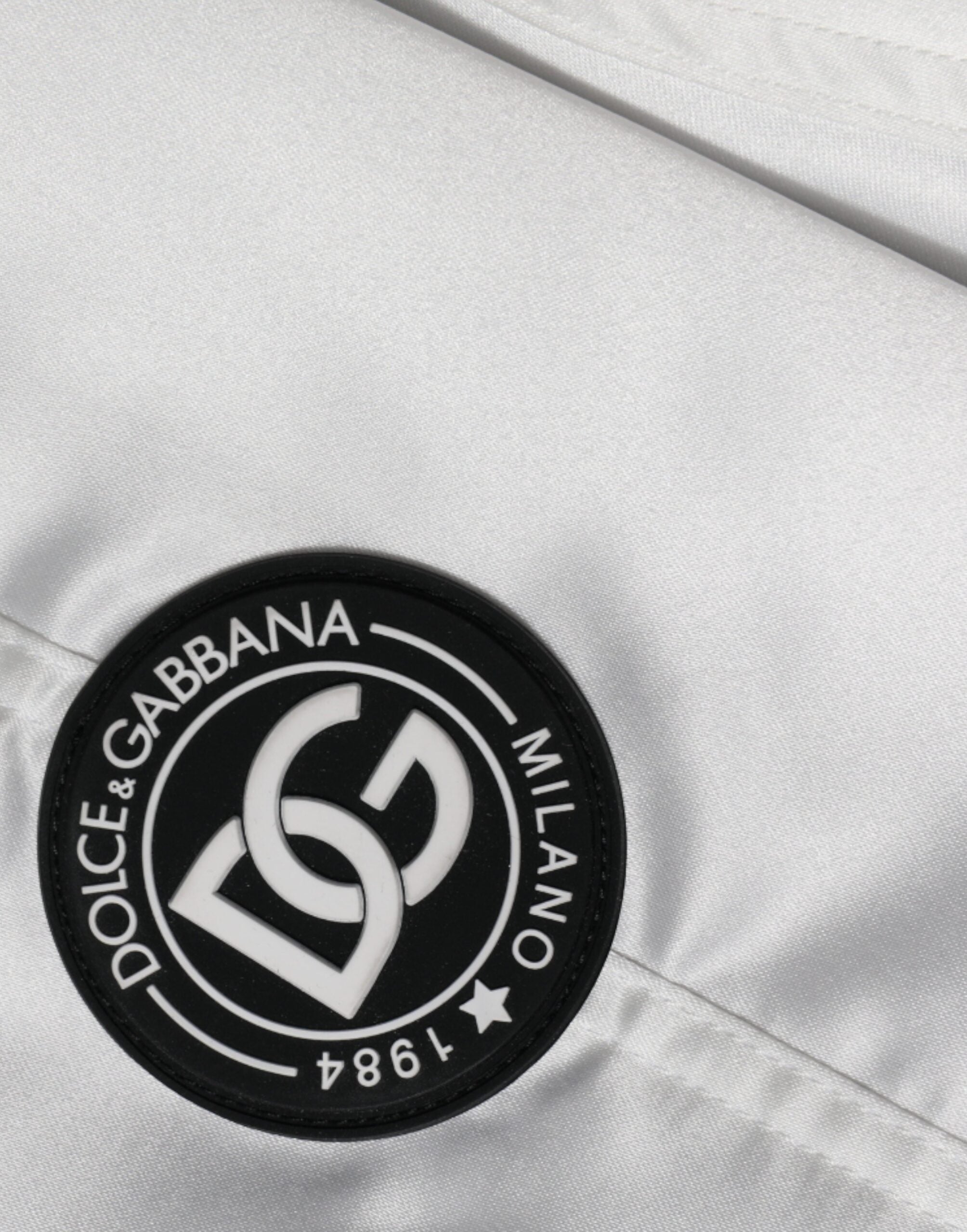 Veste bomber blanche en polyester Dolce & Gabbana avec logo, zip complet, style moderne et élégant.