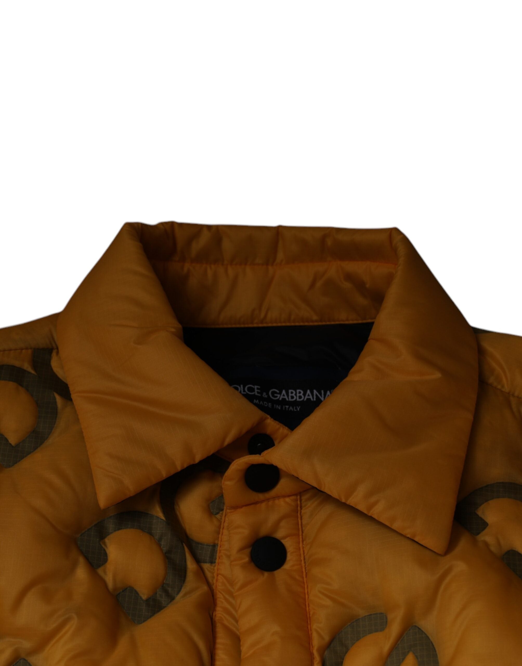 Veste matelassée jaune Dolce & Gabbana avec logo, boutons et design élégant, vue de face.