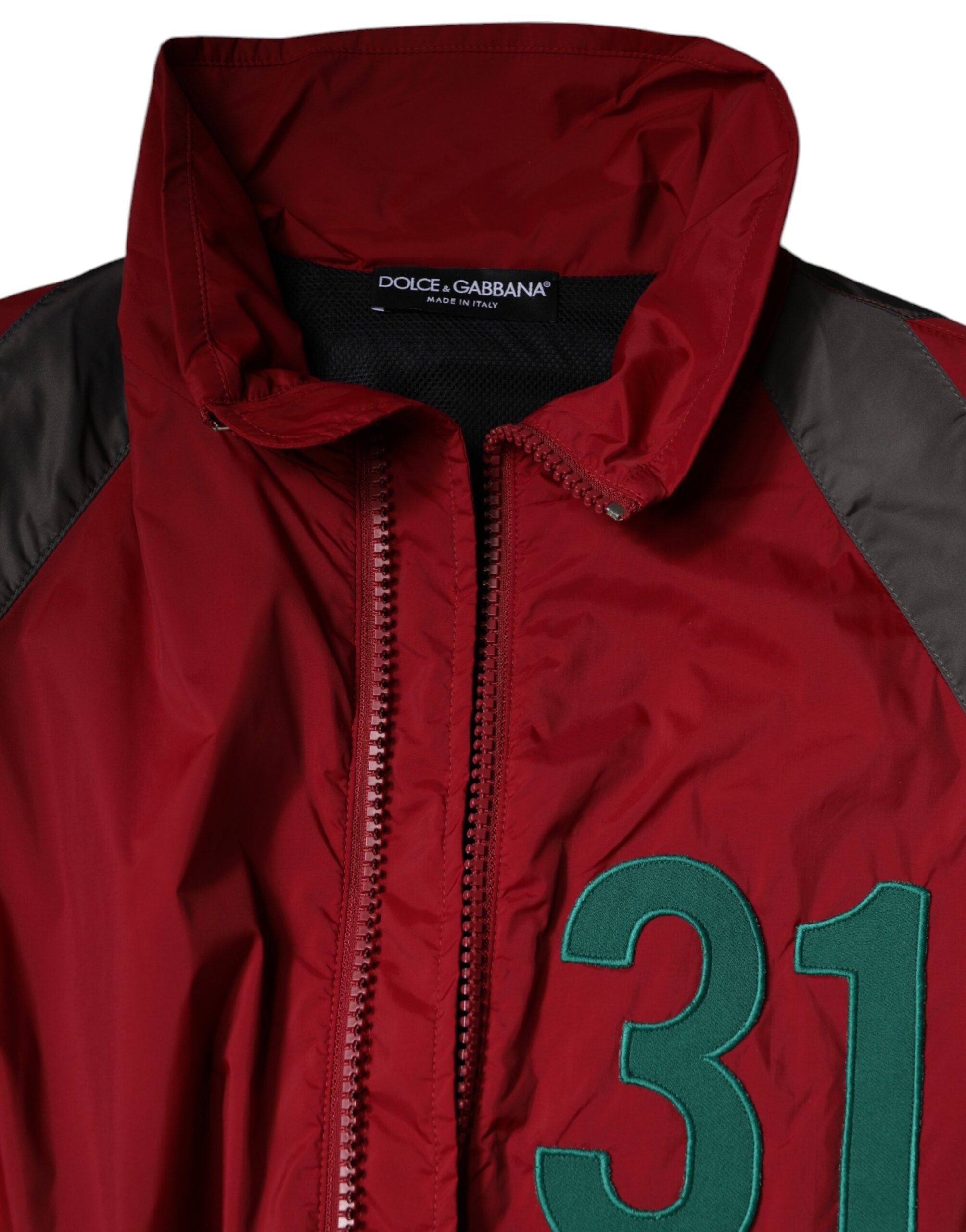 Veste coupe-vent en nylon multicolore Dolce & Gabbana avec fermeture éclair complète, style moderne et coloré.