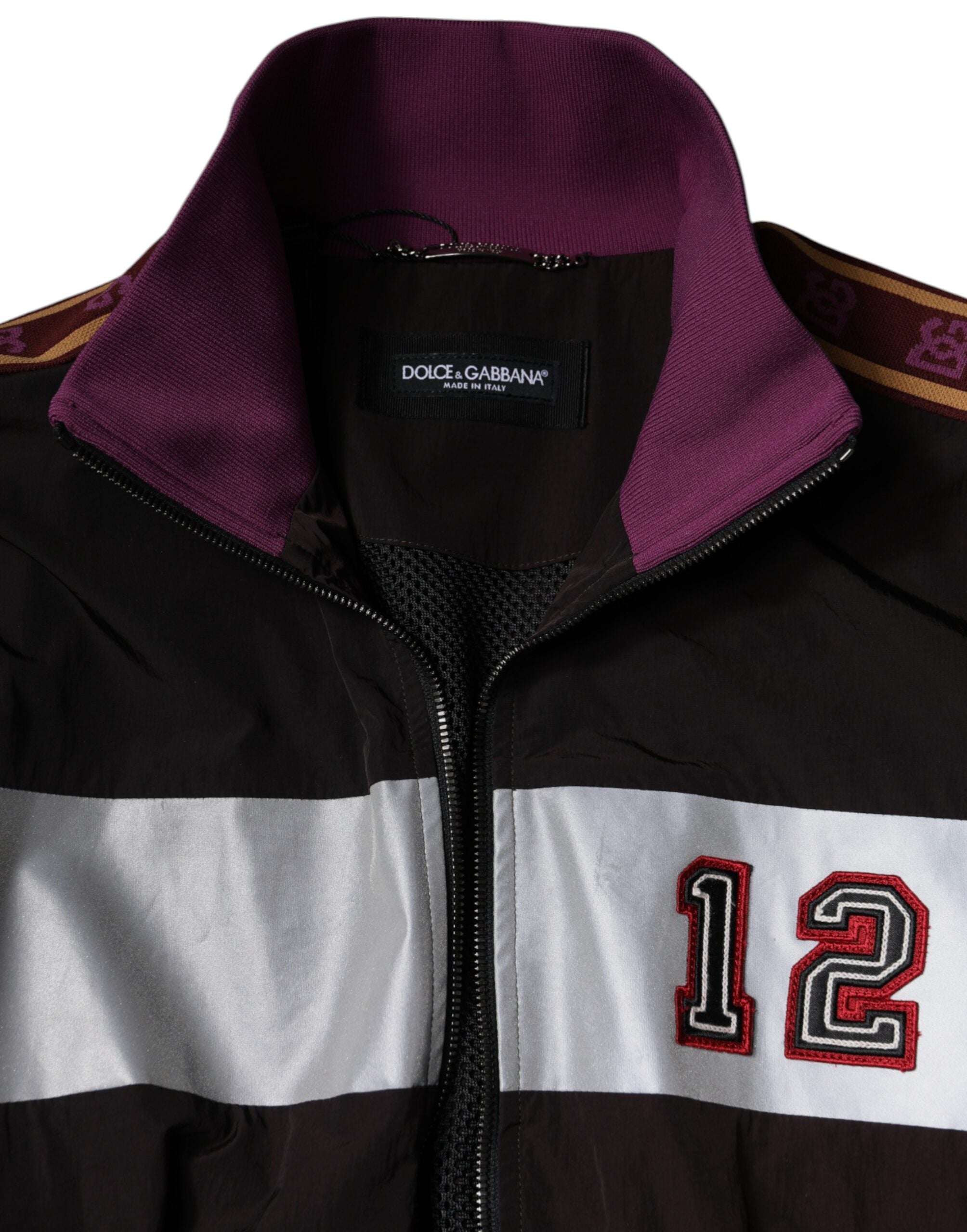 Veste bomber homme Dolce & Gabbana en jersey multicolore avec fermeture éclair complète, style moderne et coloré.