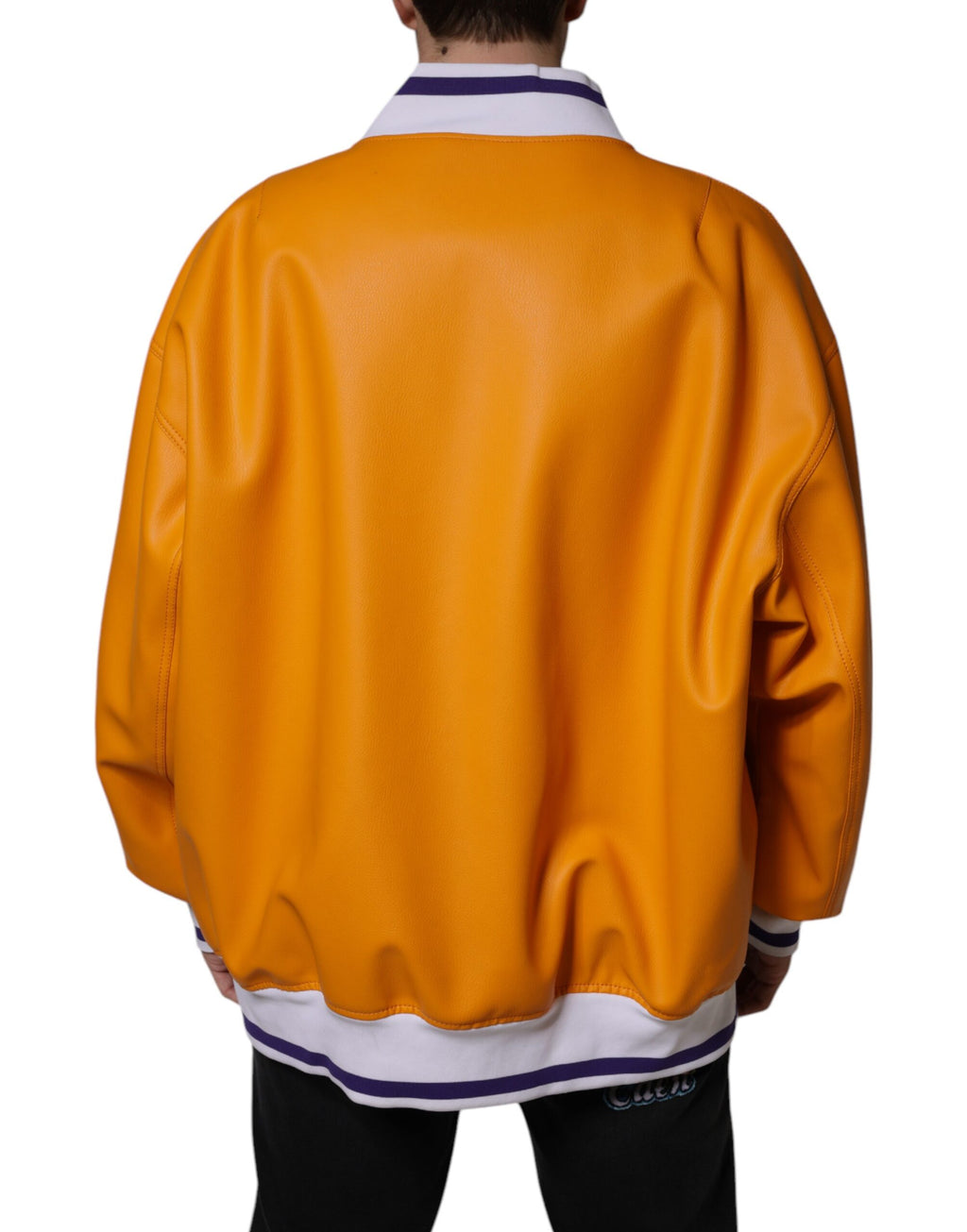 Veste bomber en jersey orange et blanc de Dolce & Gabbana avec fermeture éclair complète, mode élégante et décontractée.