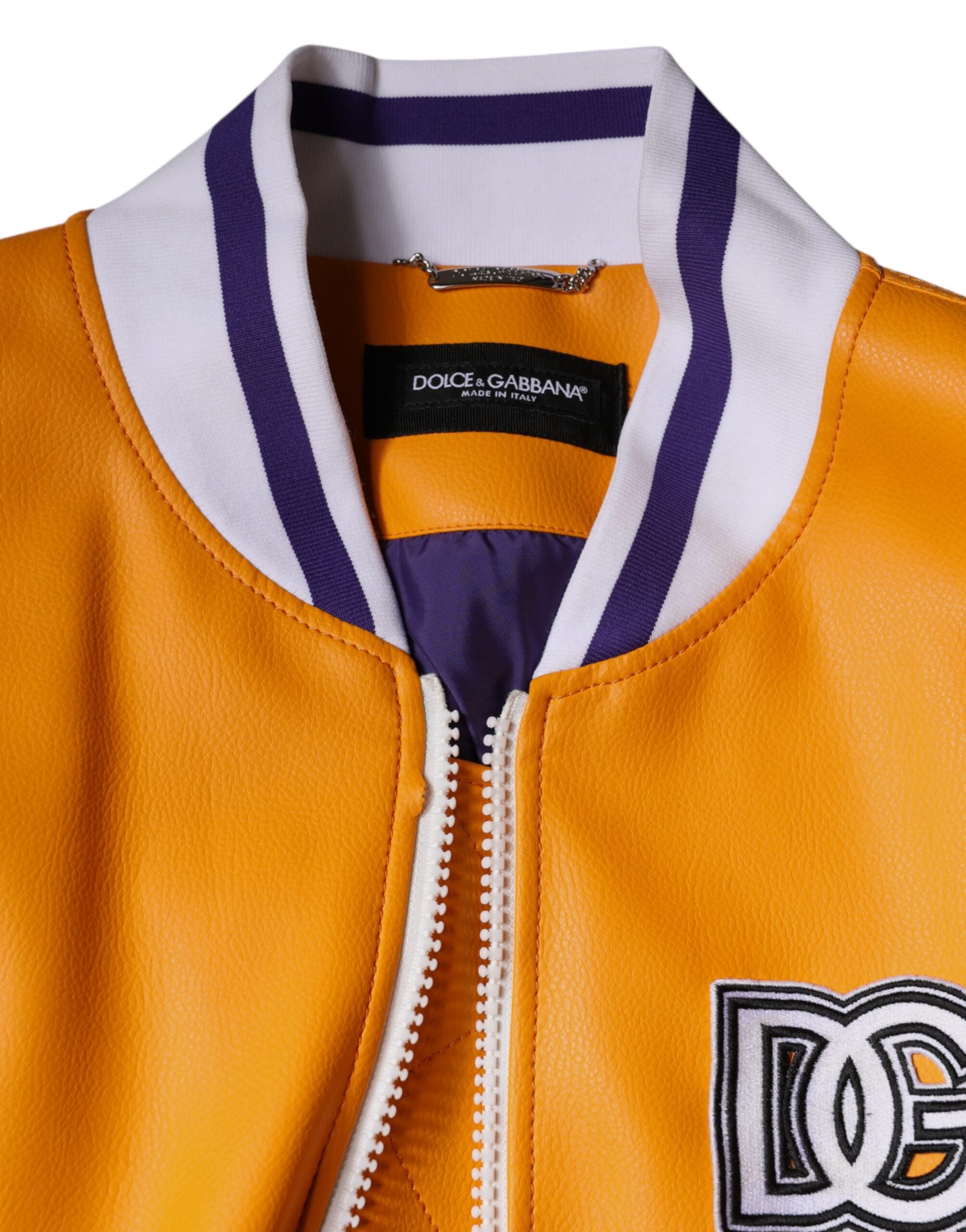 Veste bomber en jersey orange et blanc Dolce & Gabbana avec fermeture éclair complète, style moderne et élégant.
