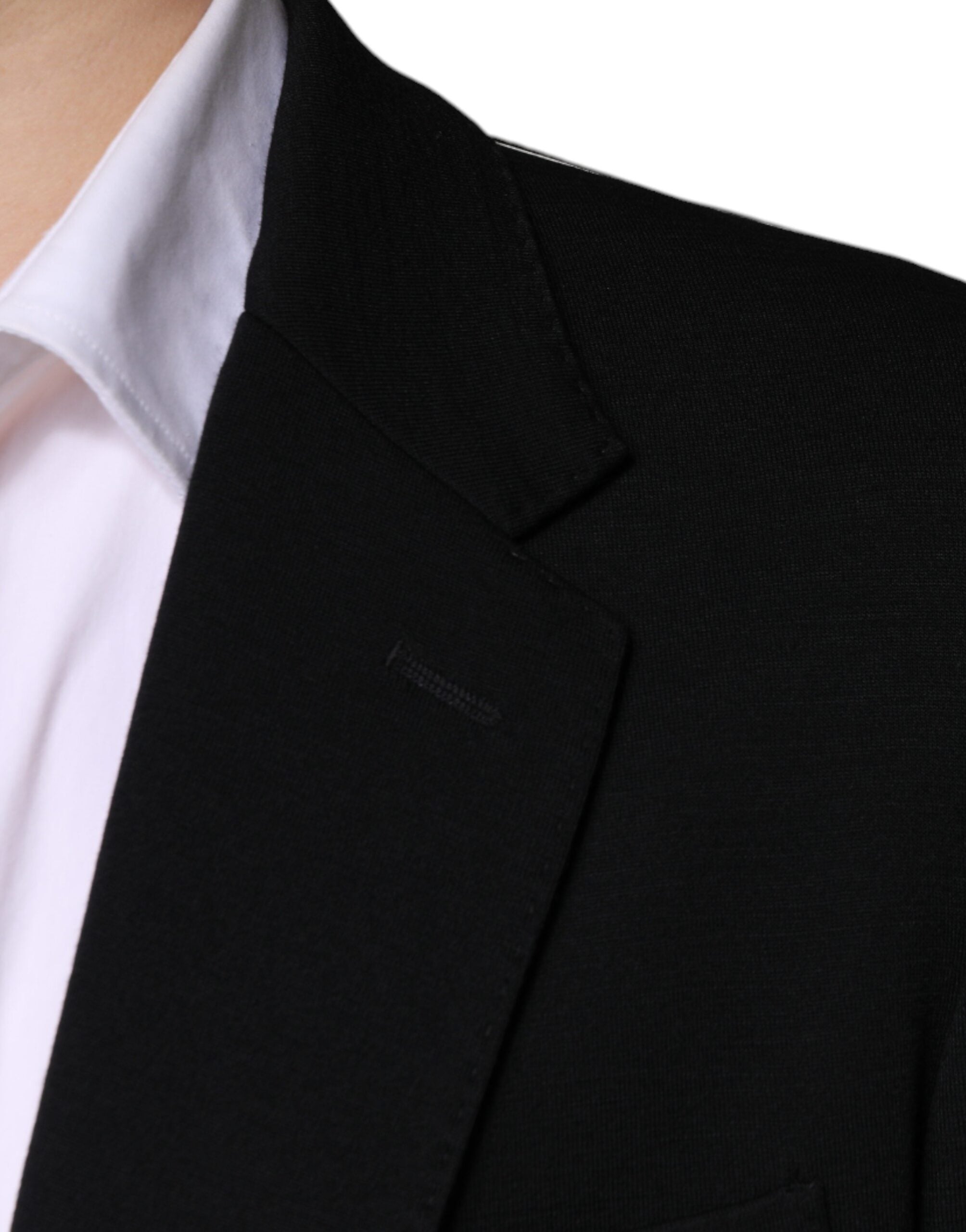 Veste formelle noire en laine Dolce & Gabbana à fermeture simple, élégante et ajustée, portée sur un mannequin.
