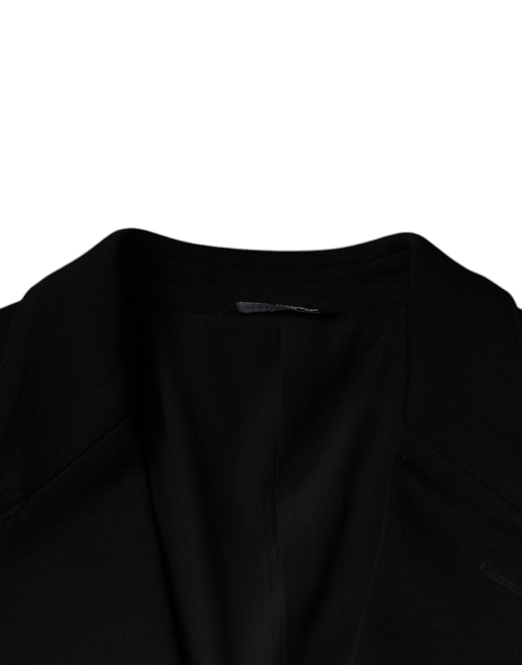 Blazer formel en laine noire Dolce & Gabbana, à un seul bouton, avec revers classiques et coupe élégante.