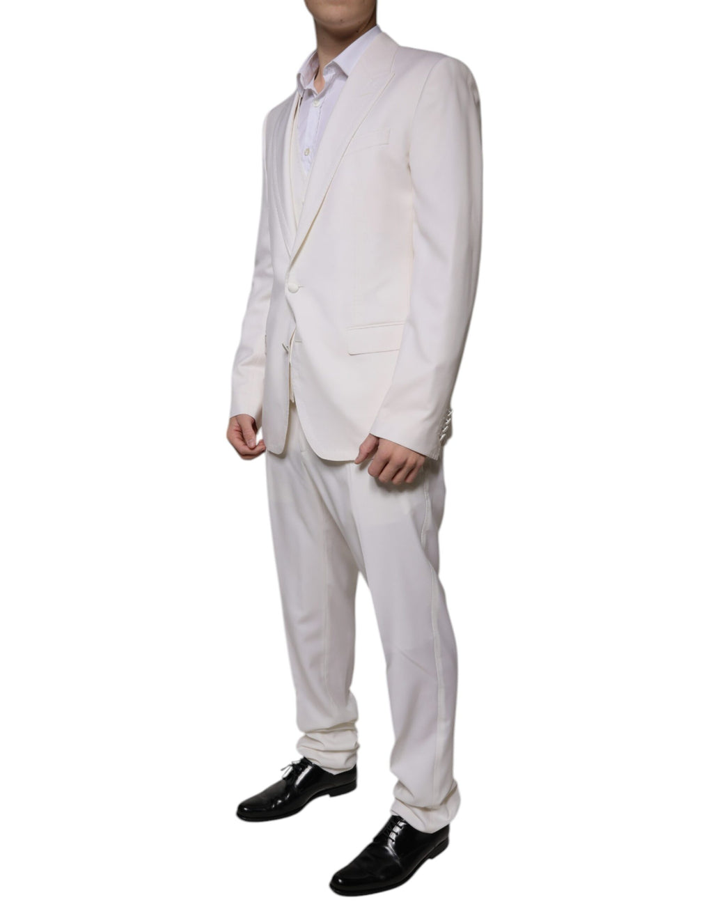 Costume formel en laine et soie blanche Dolce & Gabbana, 3 pièces, coupe slim fit, détails élégants et sophistiqués.