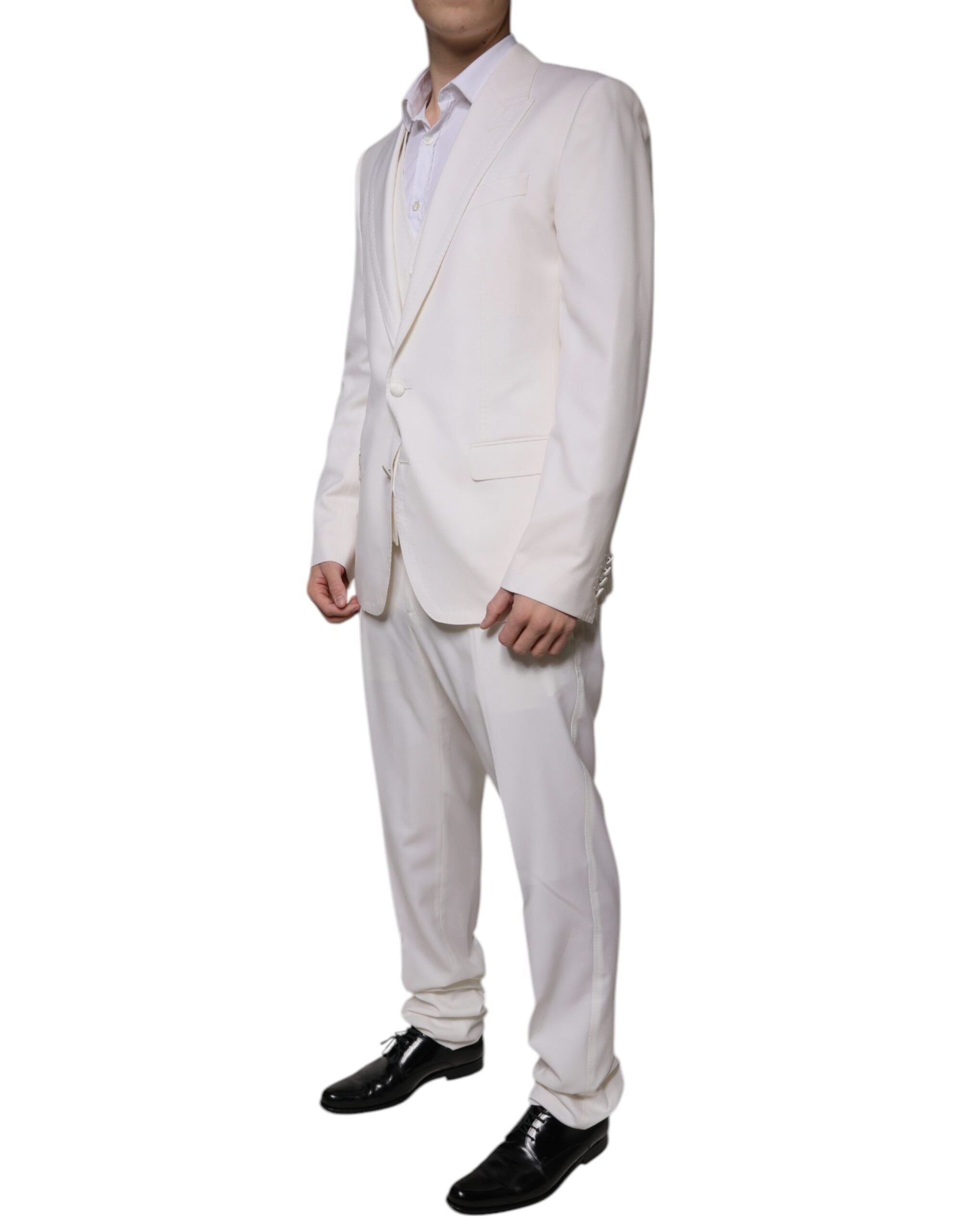 Costume formel en laine et soie blanche Dolce & Gabbana, 3 pièces, coupe slim fit, détails élégants et sophistiqués.