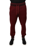 Pantalon jogging homme Dolce & Gabbana en coton rouge foncé, style décontracté avec ceinture élastique et poches latérales.