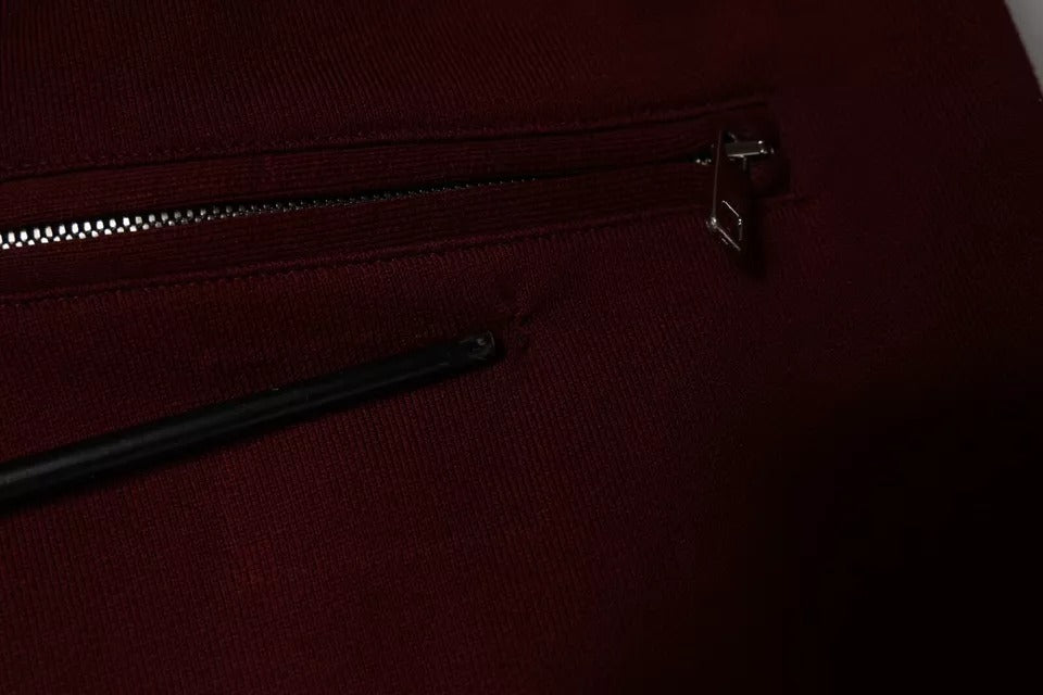 Pantalon jogger en coton rouge foncé pour homme de la marque Dolce & Gabbana, vue de face.