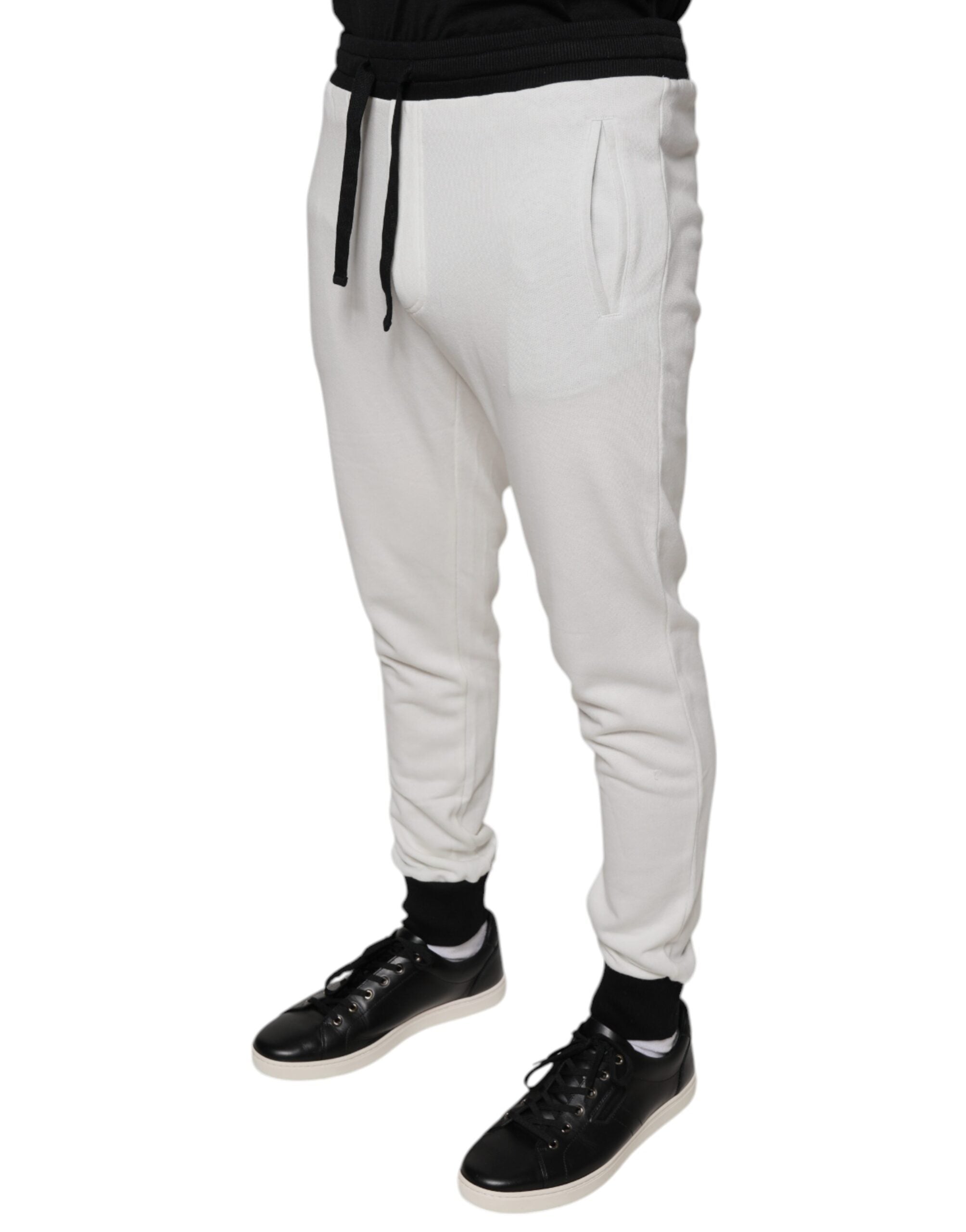 Pantalon de jogging blanc en coton pour homme Dolce & Gabbana, coupe slim et confortable, vue de face sur fond neutre.