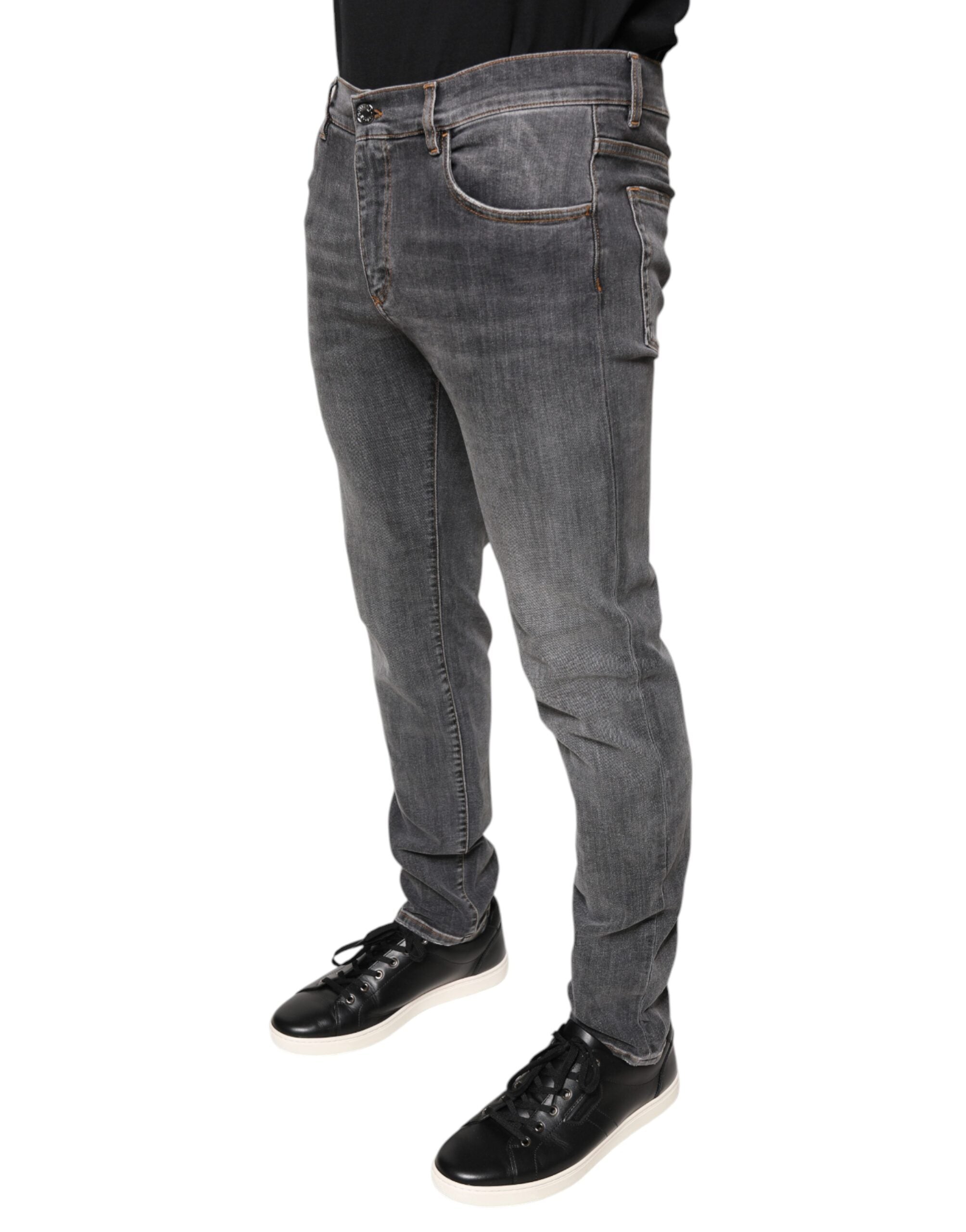 Jeans skinny en denim coton stretch gris foncé de Dolce & Gabbana, affichant une coupe ajustée et des détails modernes.