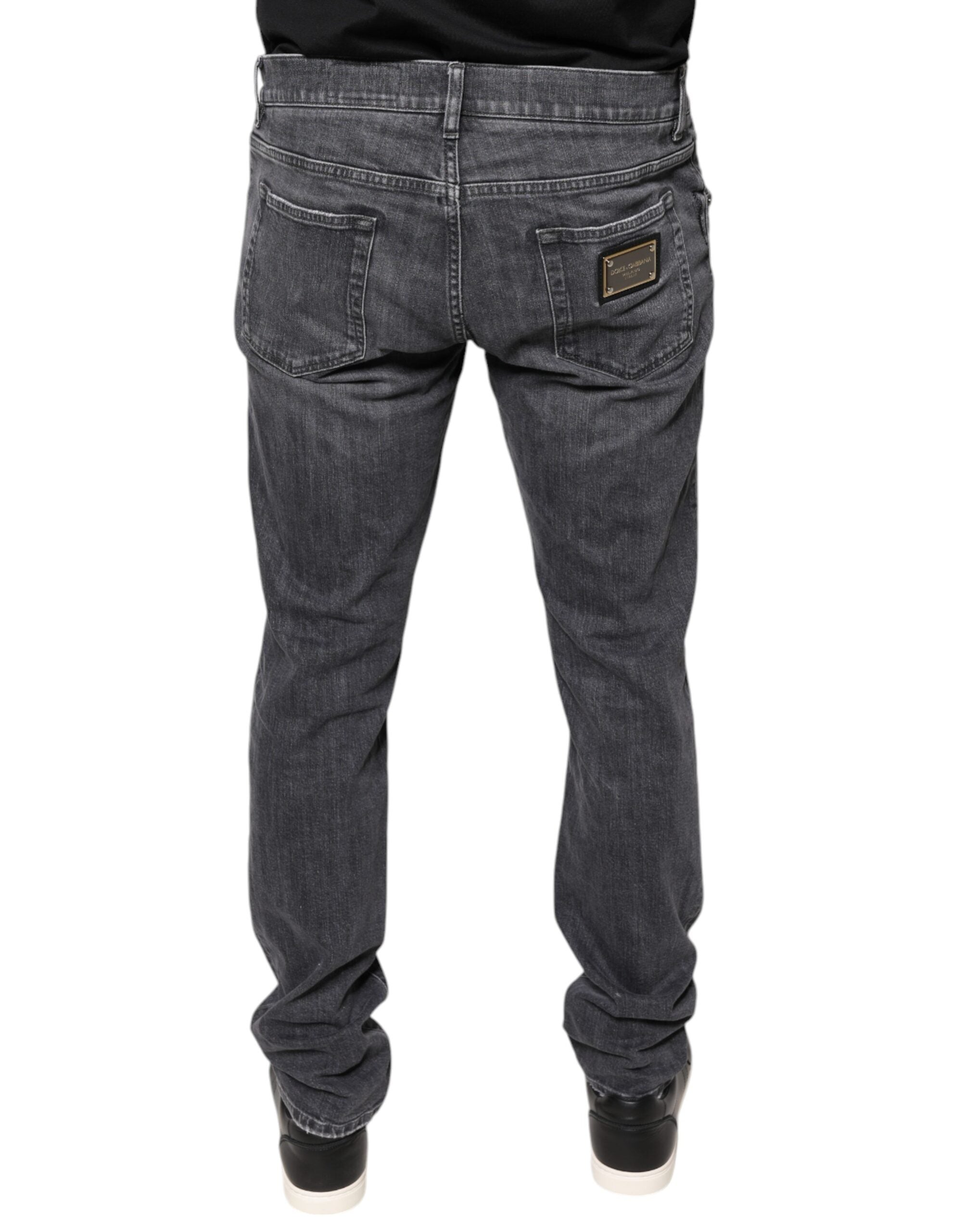 Jeans slim en denim coton gris foncé déchiré de Dolce & Gabbana, coupe skinny, détails usés et déchirés visibles.