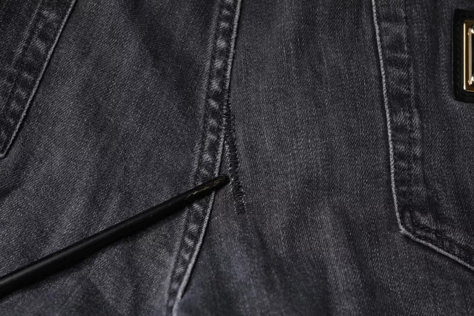 Jeans skinny en denim coton gris foncé déchiré de Dolce & Gabbana, style décontracté avec détails usés et coupe ajustée.