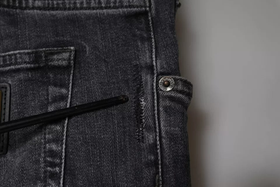 Jeans slim en denim coton gris foncé déchiré de Dolce & Gabbana, style skinny avec détails usés.