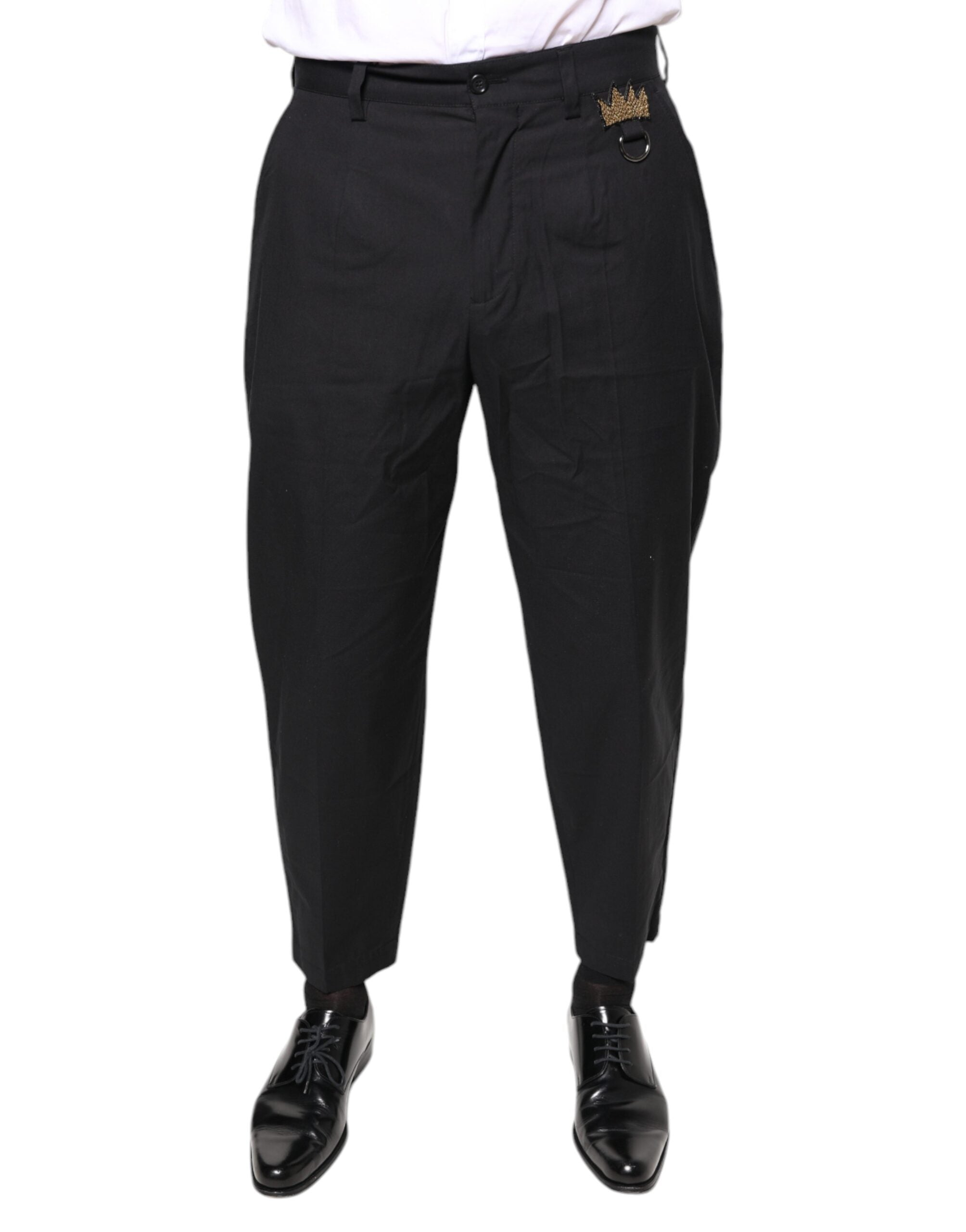 Pantalon en coton noir Dolce & Gabbana avec motif de couronne, pantalon élégant pour femme, vue de face sur modèle.