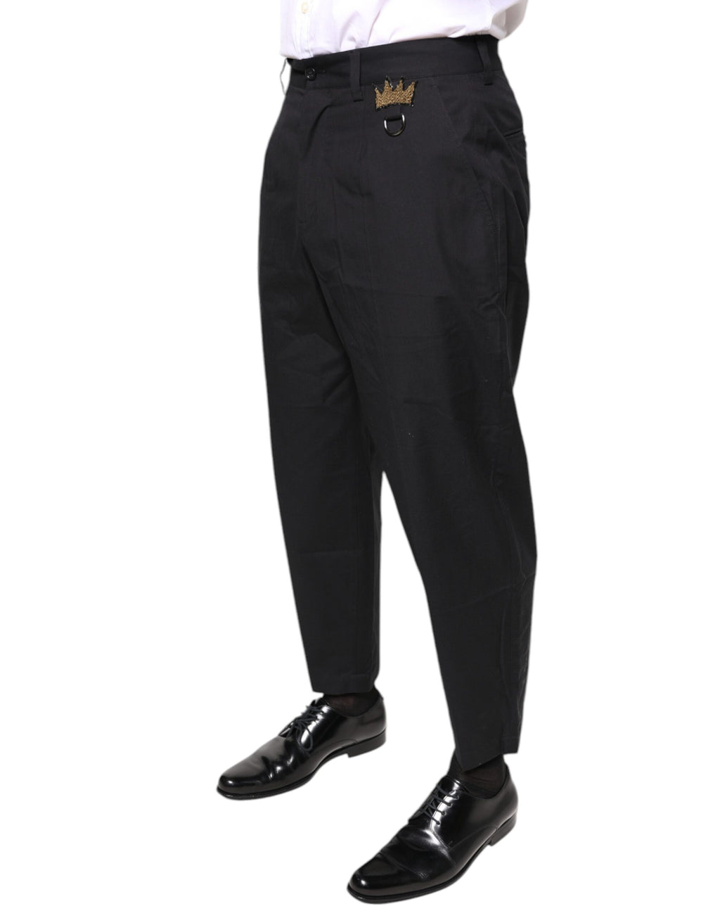 Pantalon habillé noir Dolce & Gabbana en coton avec ceinture en forme de couronne, style élégant et sophistiqué.