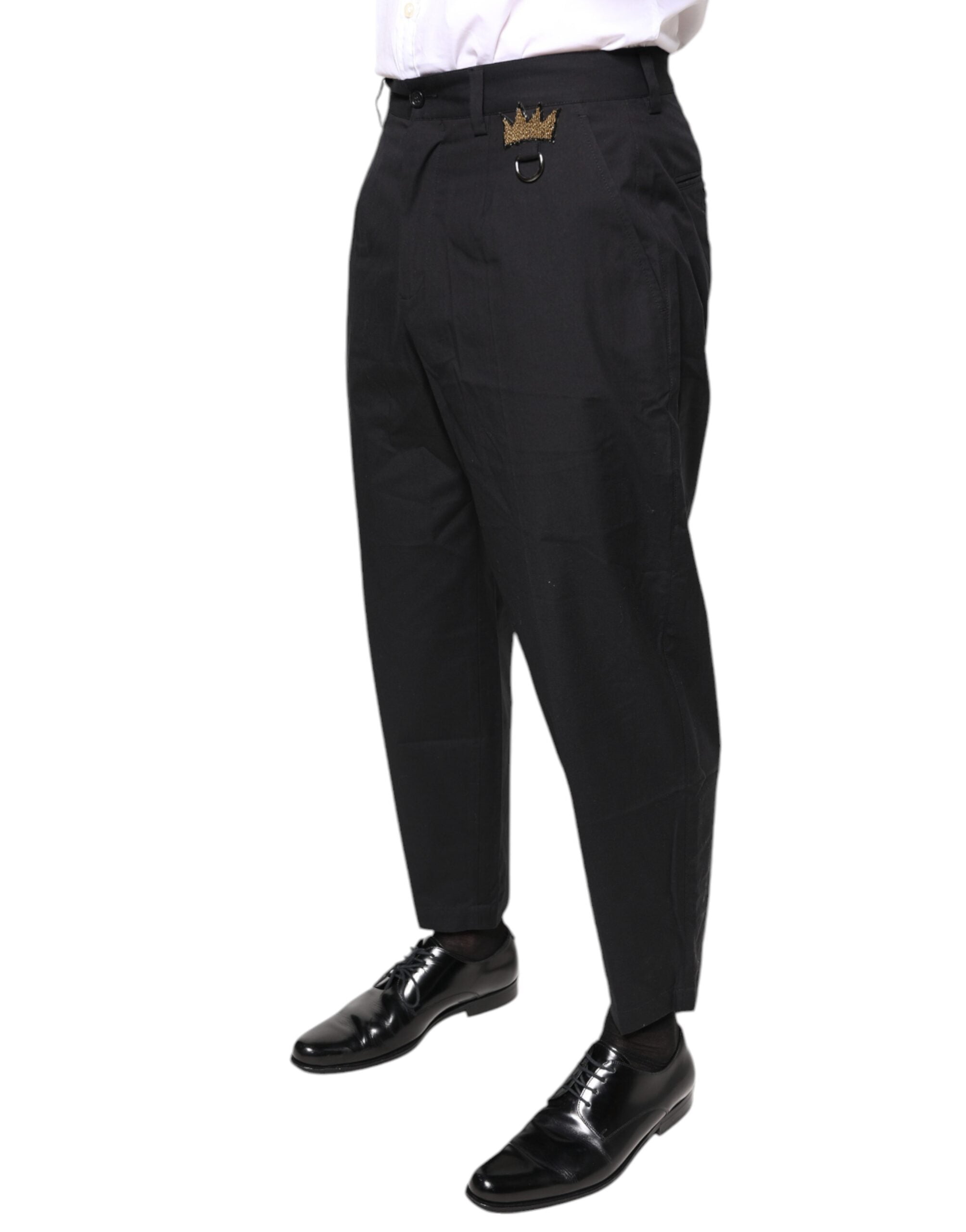 Pantalon habillé noir Dolce & Gabbana en coton avec ceinture en forme de couronne, style élégant et sophistiqué.