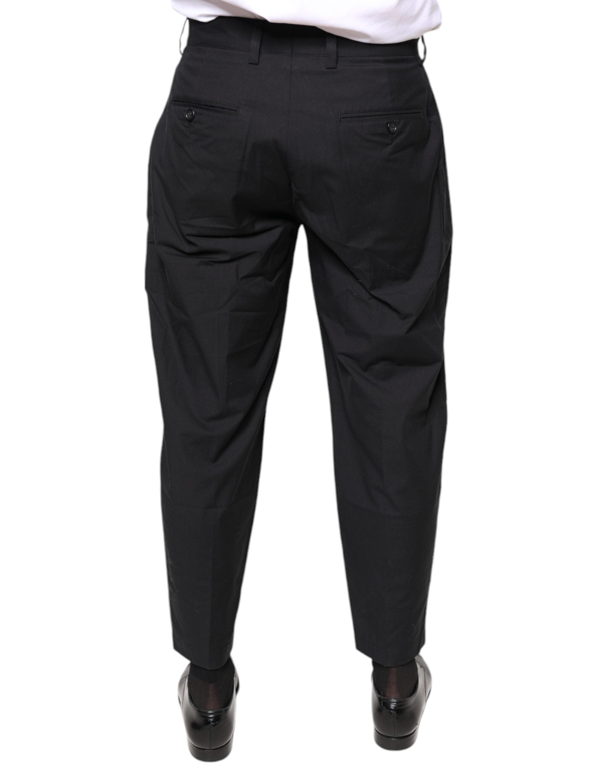 Pantalon homme Dolce & Gabbana en coton noir avec motif couronne, coupe élégante et moderne.