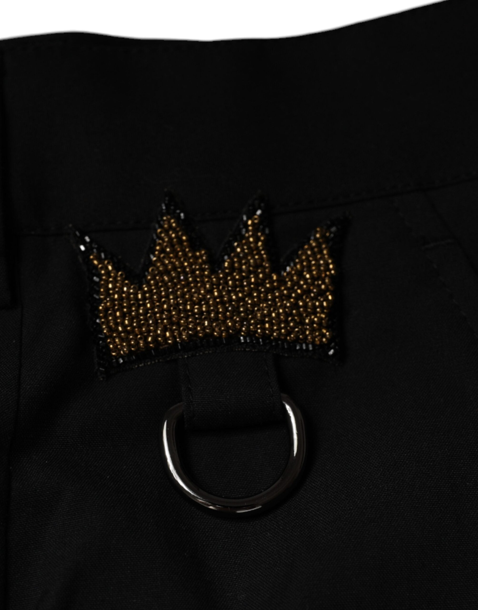 Pantalon en coton noir Dolce & Gabbana avec motif couronne, élégant et sophistiqué, idéal pour une tenue chic et moderne.