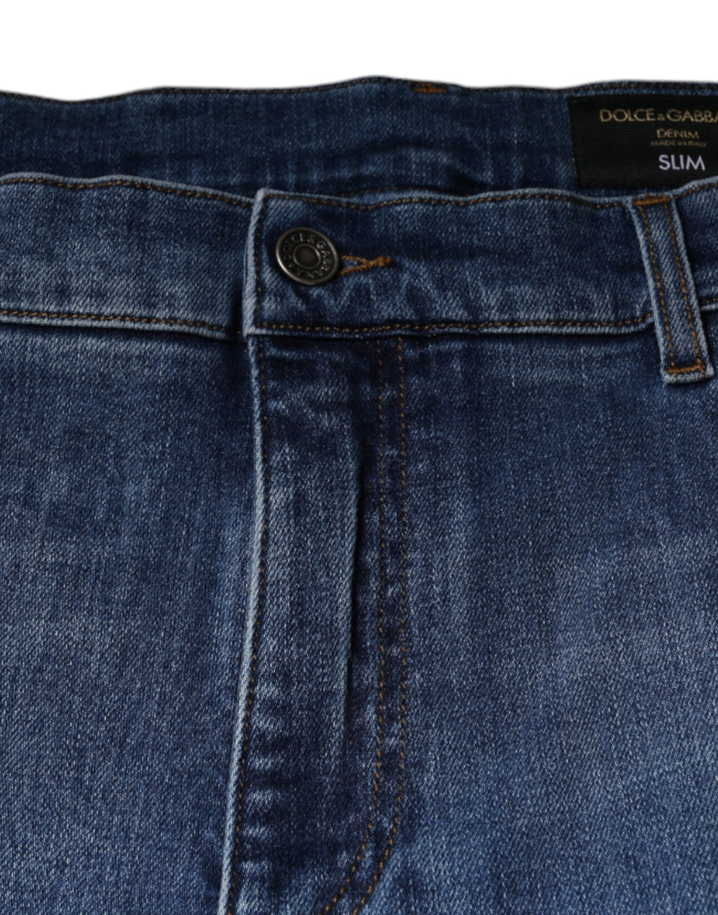 Jeans pour homme Dolce & Gabbana en coton délavé bleu, coupe stretch et denim, visibles avec détails de couture et fermeture éclair.