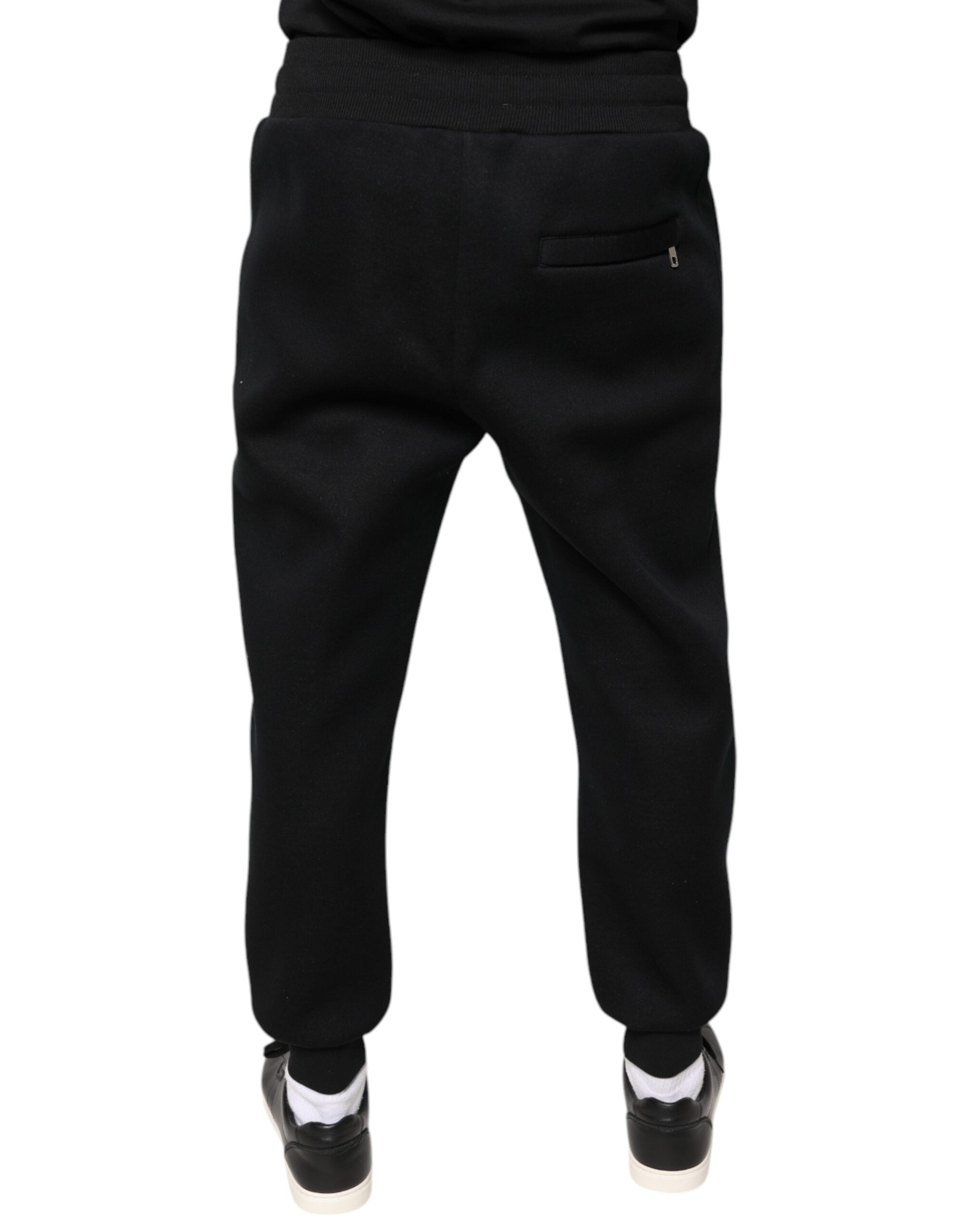 Pantalon jogging homme Dolce & Gabbana en modal noir avec logo DG, confort et style décontracté.