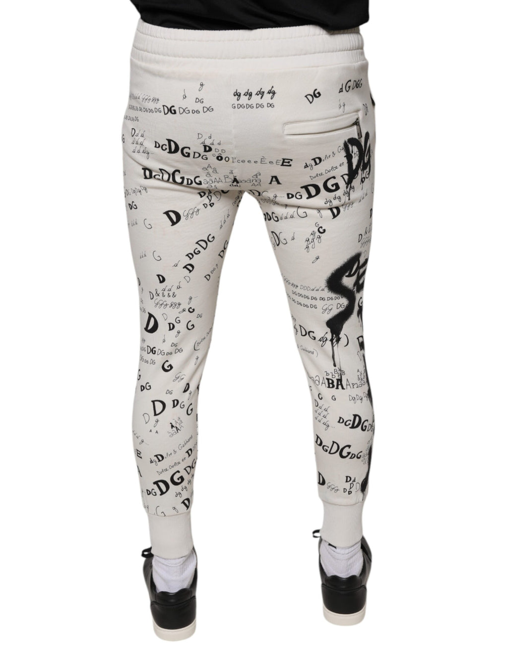 Pantalon jogger en coton blanc imprimé de Dolce & Gabbana, style décontracté avec tresse et détails élégants.