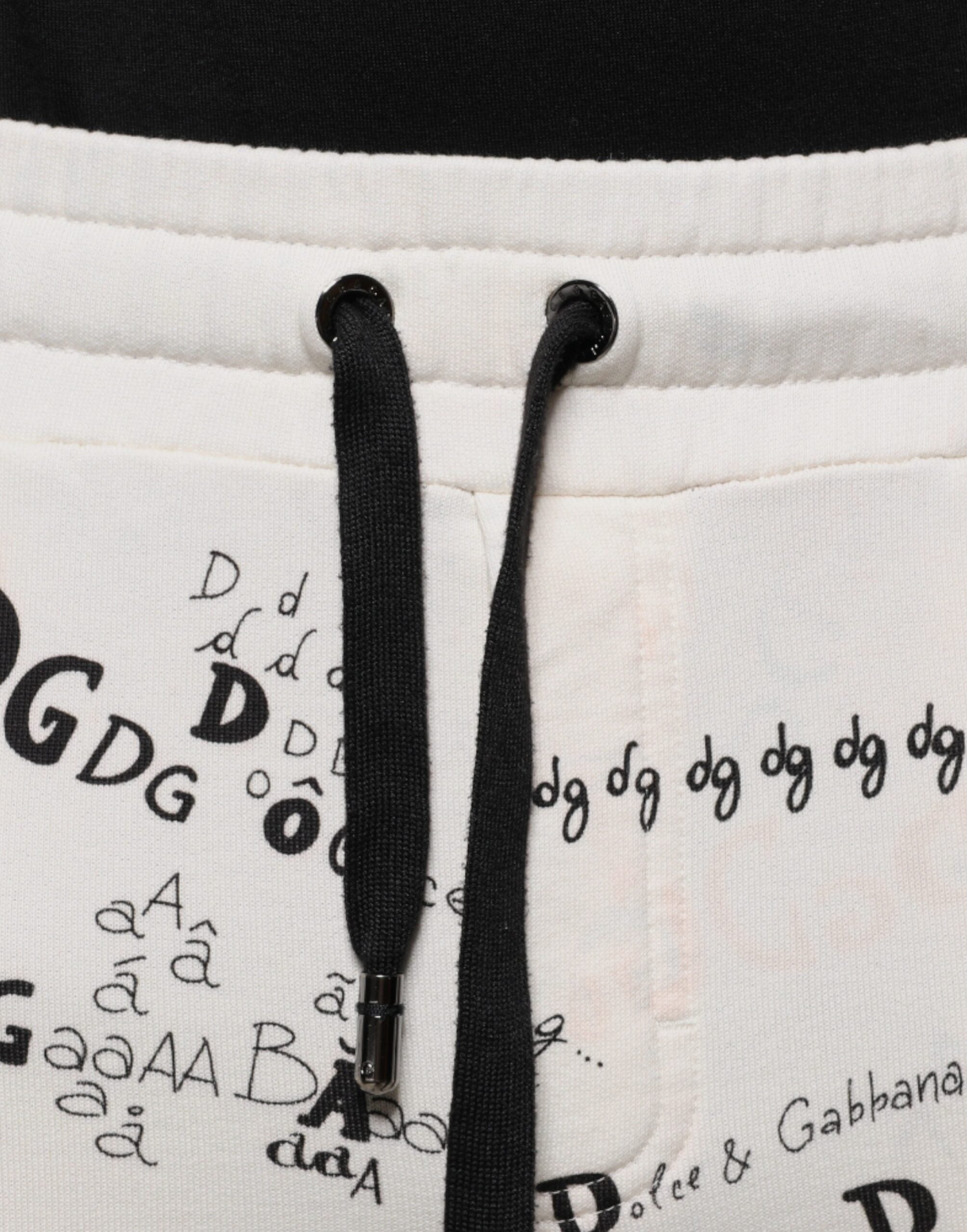 Pantalon de jogging blanc en coton imprimé de Dolce & Gabbana, style décontracté avec ceinture élastique et poches latérales.