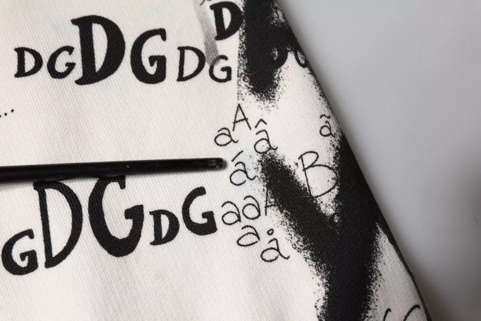 Pantalons joggers en coton blanc imprimé de Dolce & Gabbana, pantalons décontractés avec motifs modernes, vue de face.