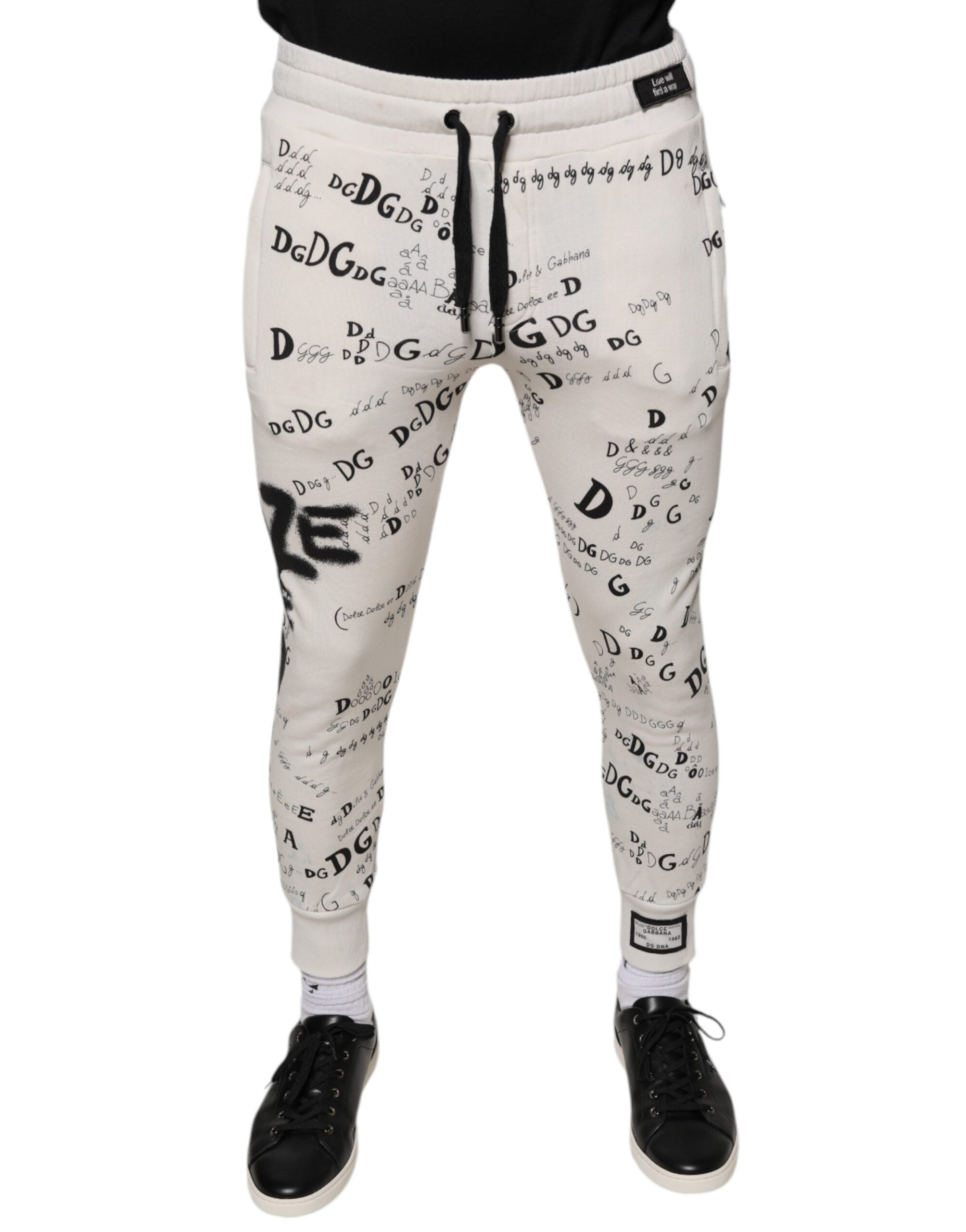 Pantalon de jogging en coton blanc imprimé Dolce & Gabbana, style décontracté avec ceinture élastique et poches latérales.
