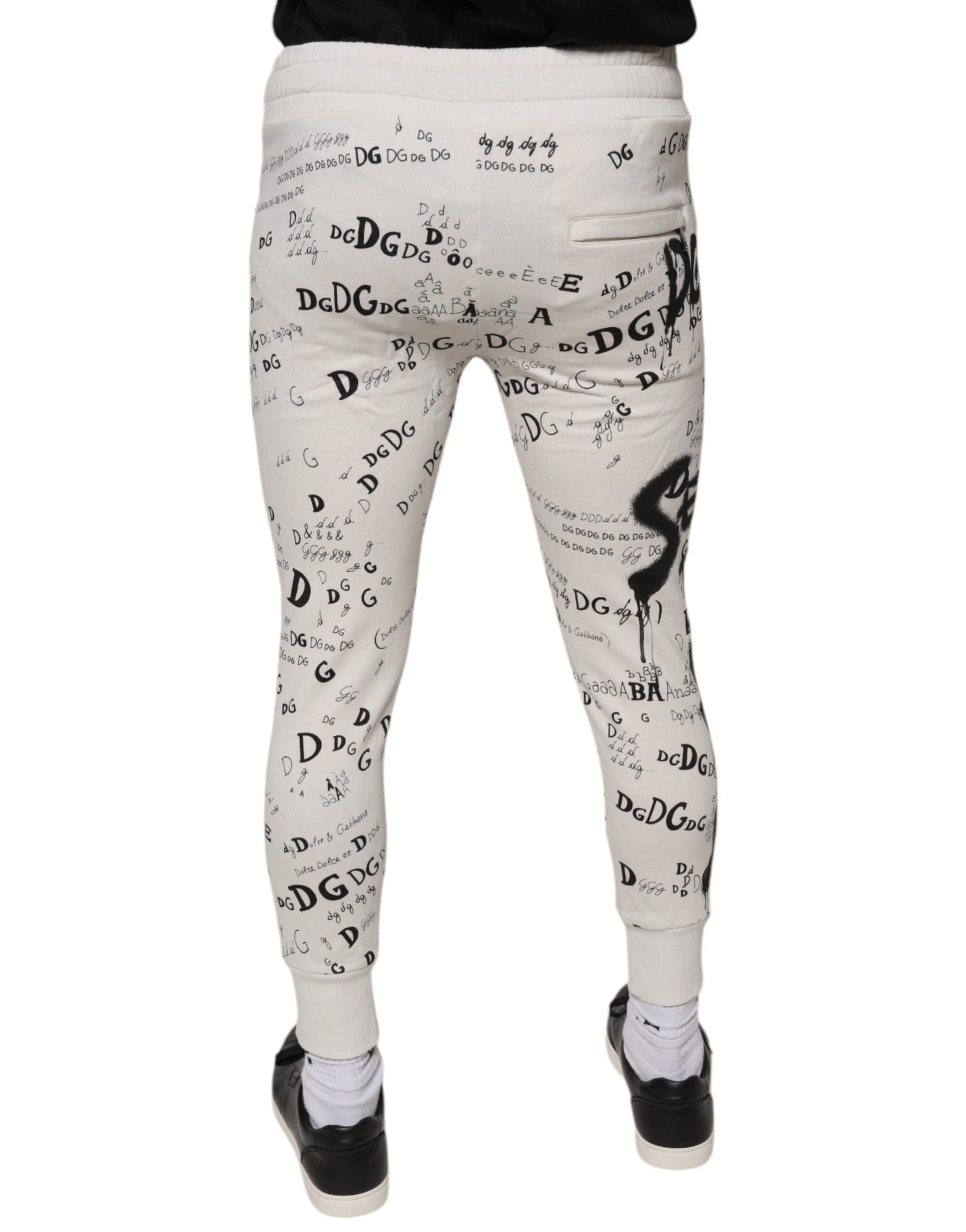 Pantalons de jogging en coton blanc imprimé de Dolce & Gabbana, style confortable et décontracté, vue de face.