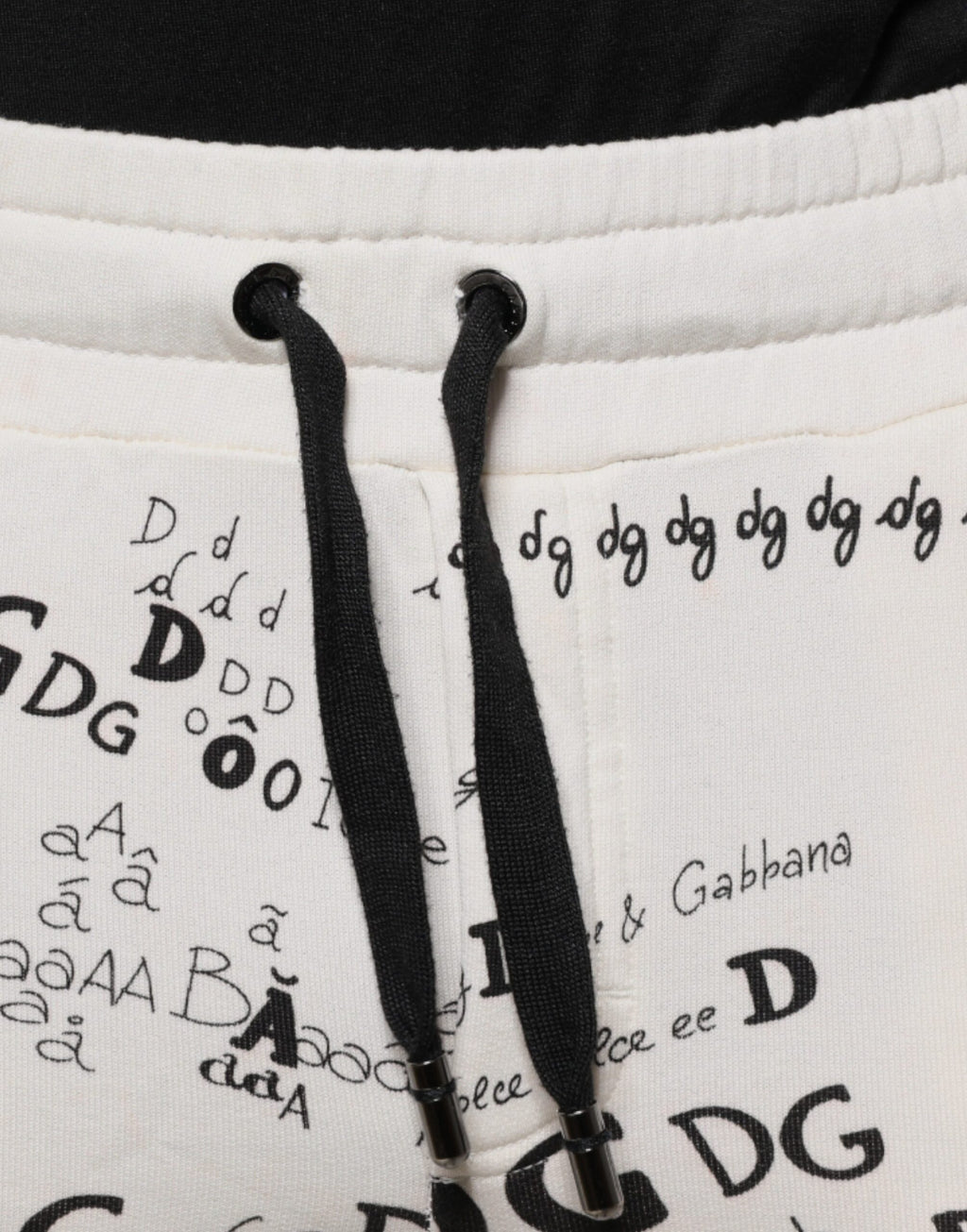 Pantalon jogging en coton blanc imprimé Dolce & Gabbana, style décontracté avec élastiques à la taille et aux chevilles.